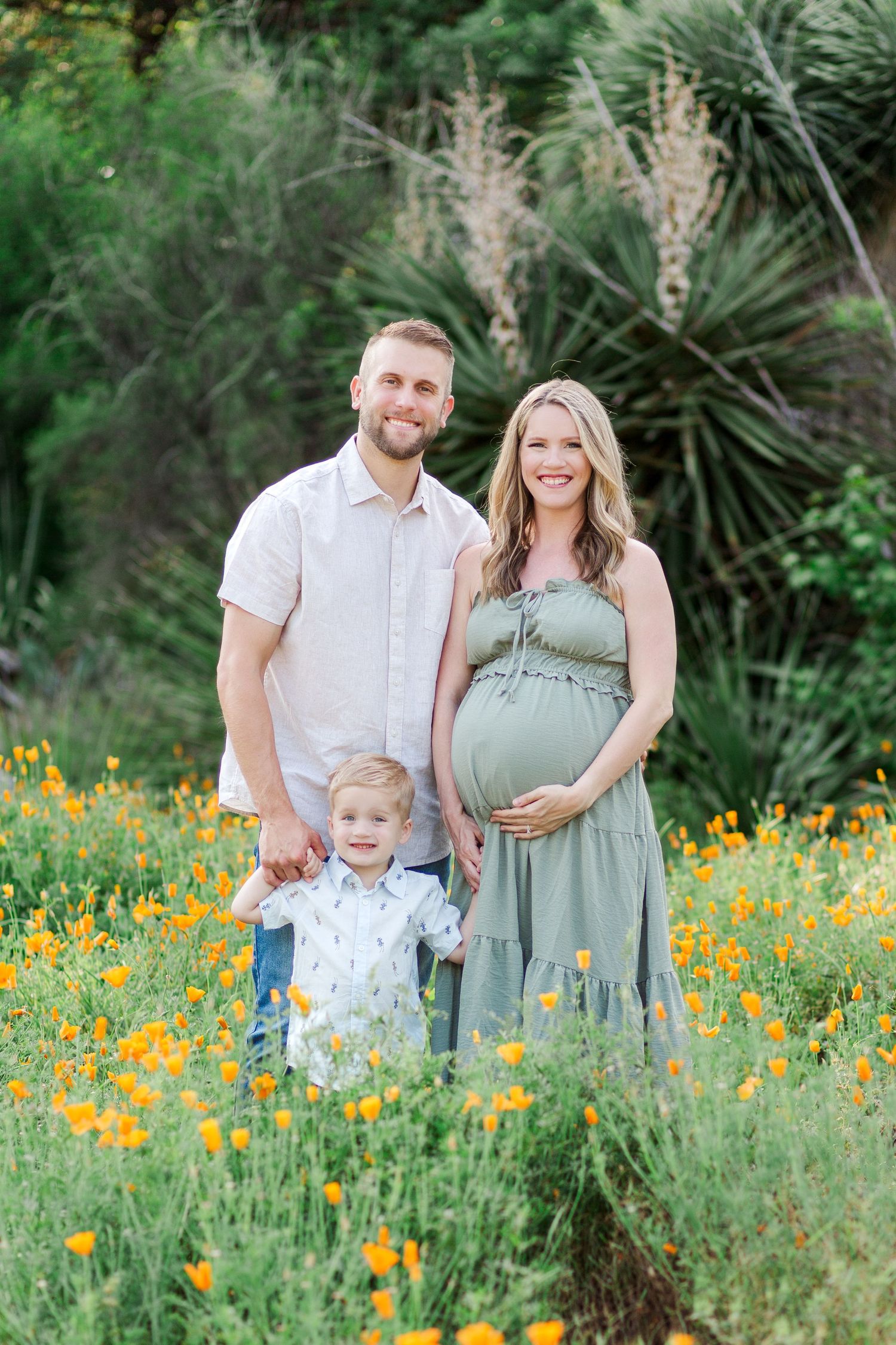 A family stands together for a Botanical Gardens spring family photo session in Clemson, SC
