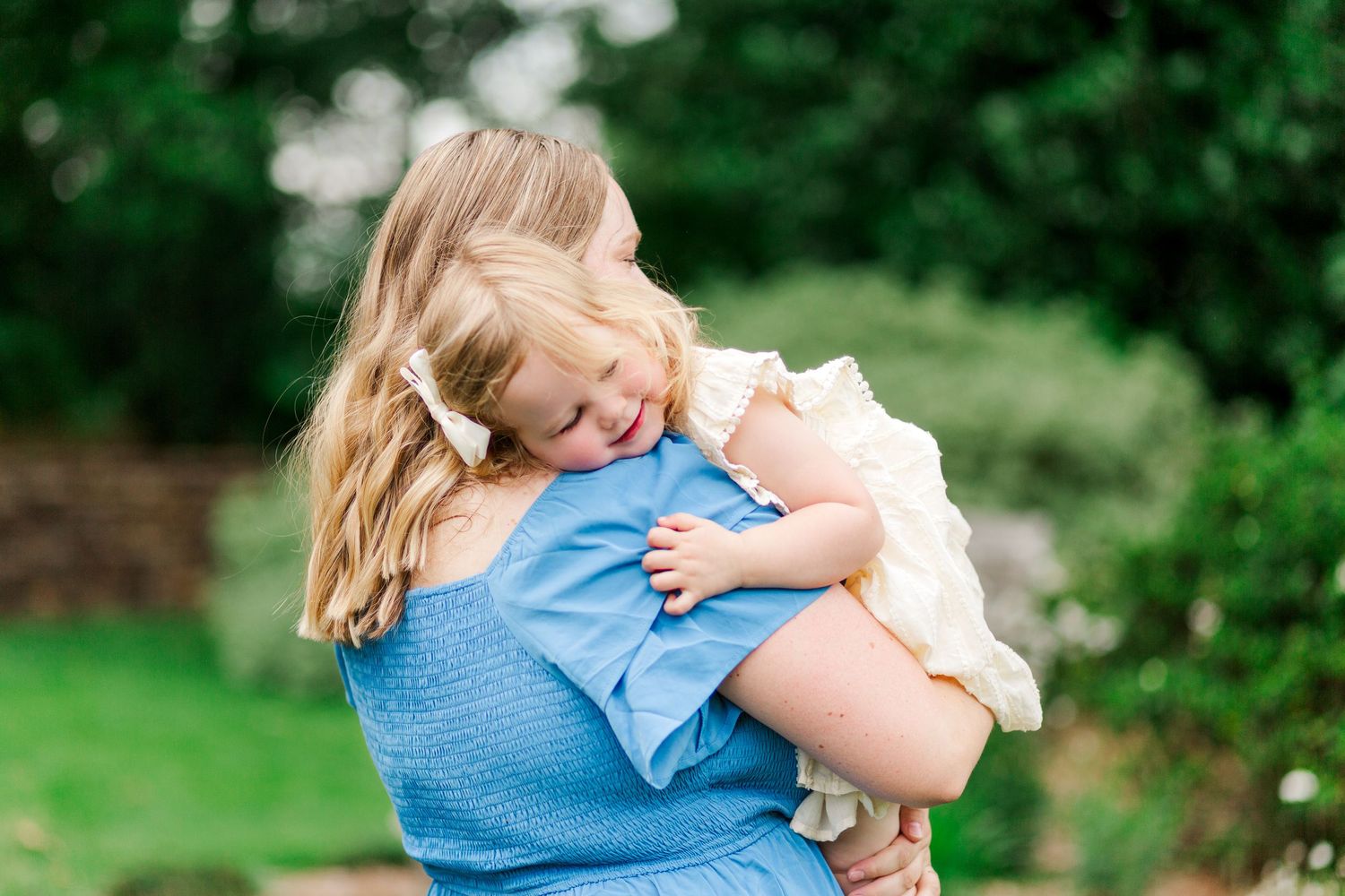 Tender embraces shared between mom and child for family photos in Clemson, SC