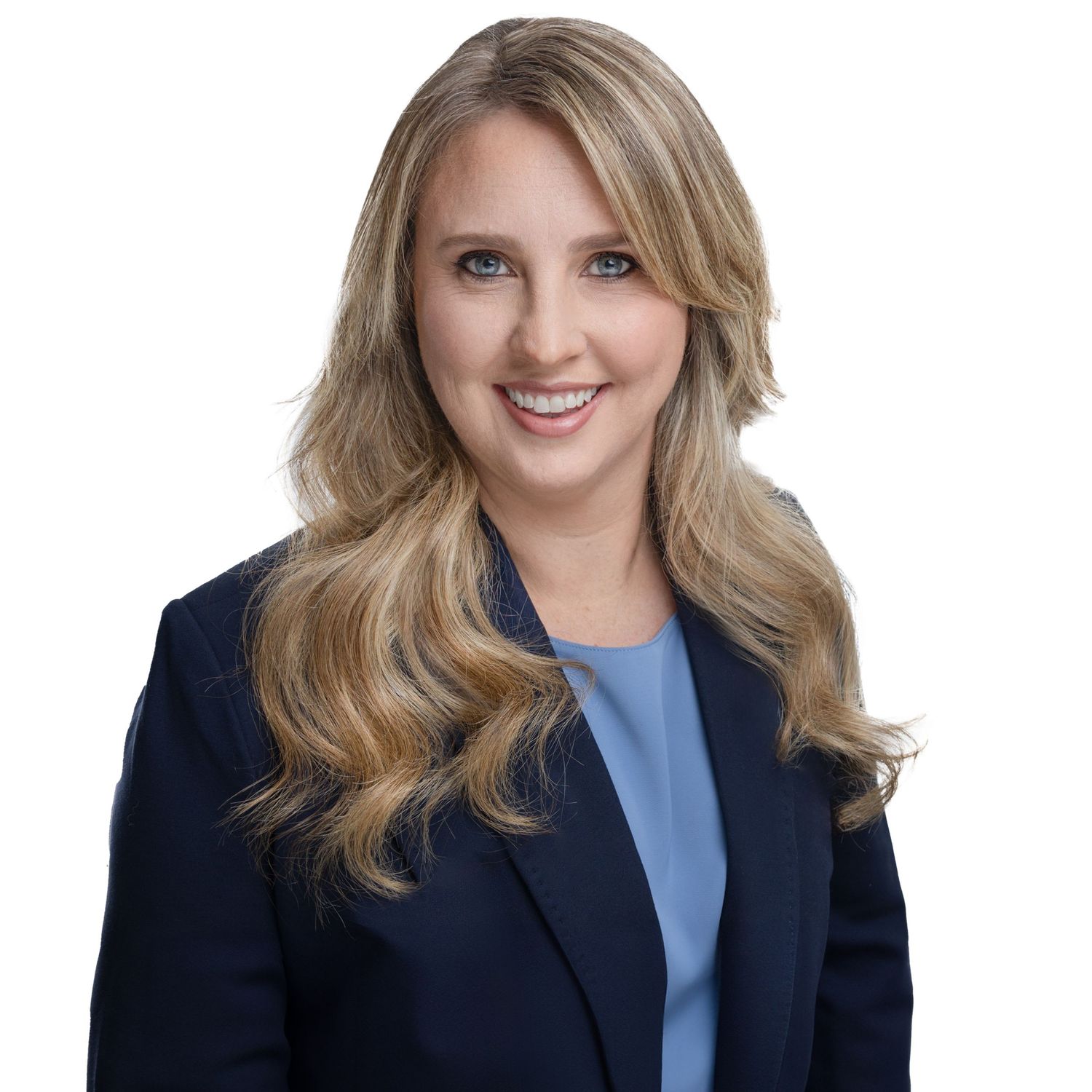Business portraits showing confident professional in navy blazer and blue top.