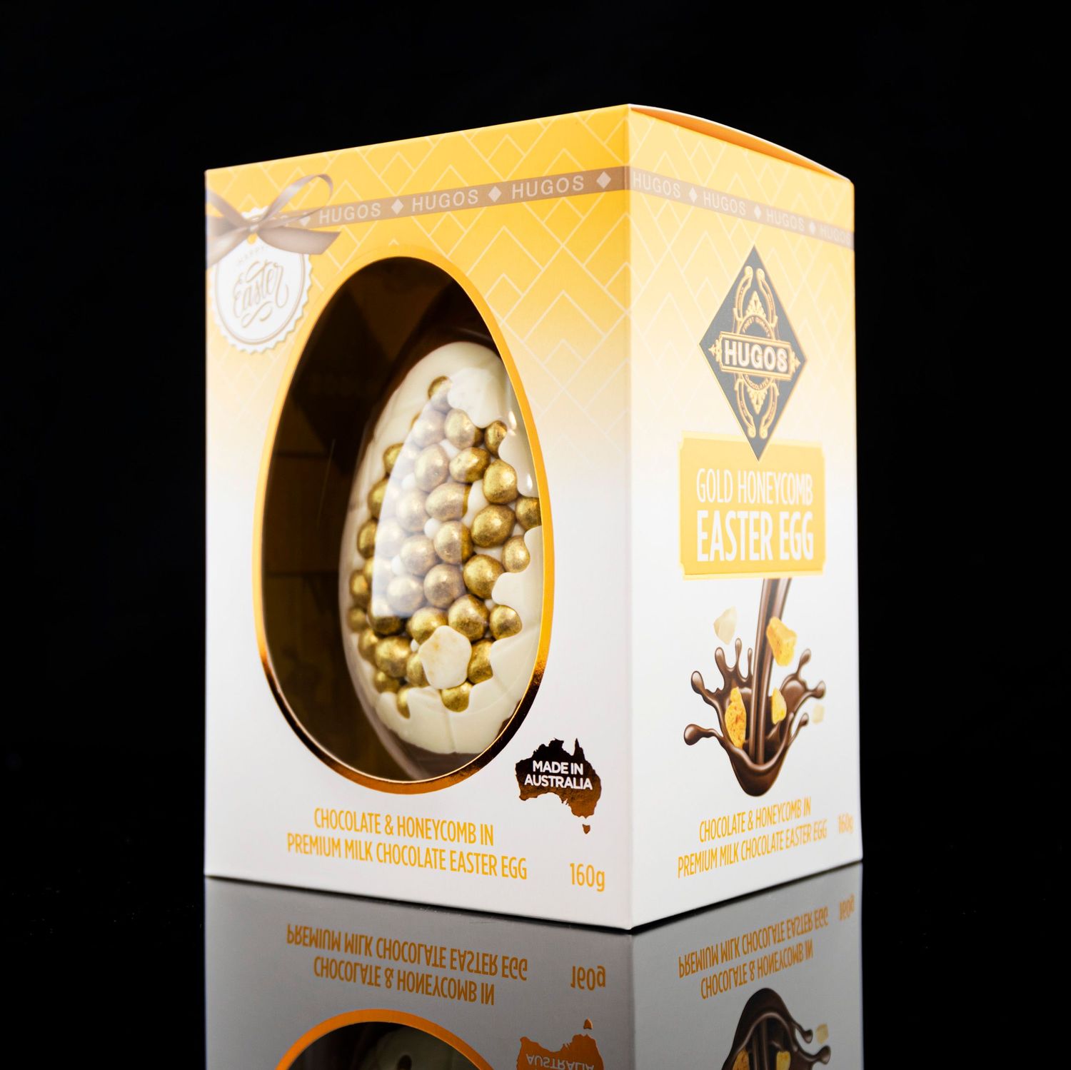 Golden chocolate egg product packaging box on black background.