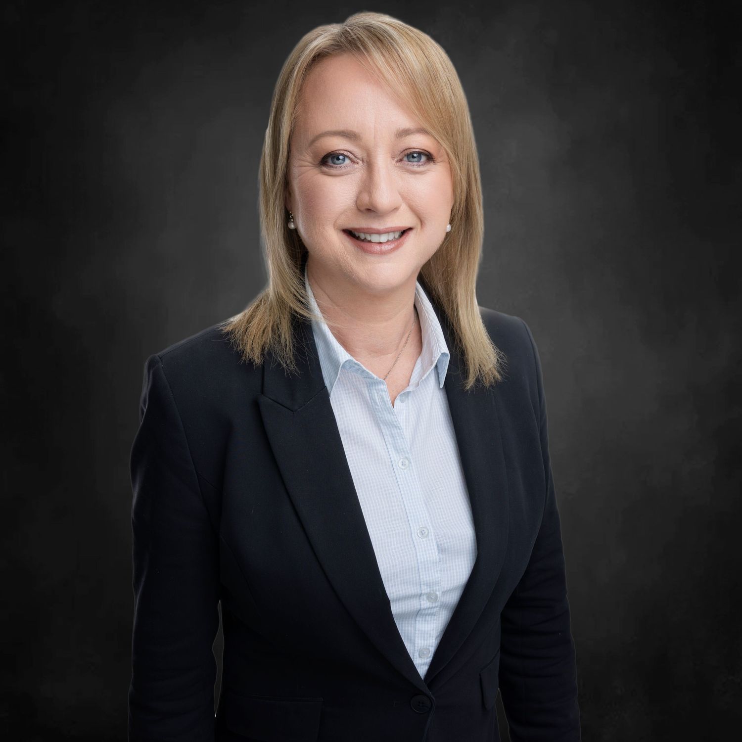 Professional headshots against dark background showing business attire.