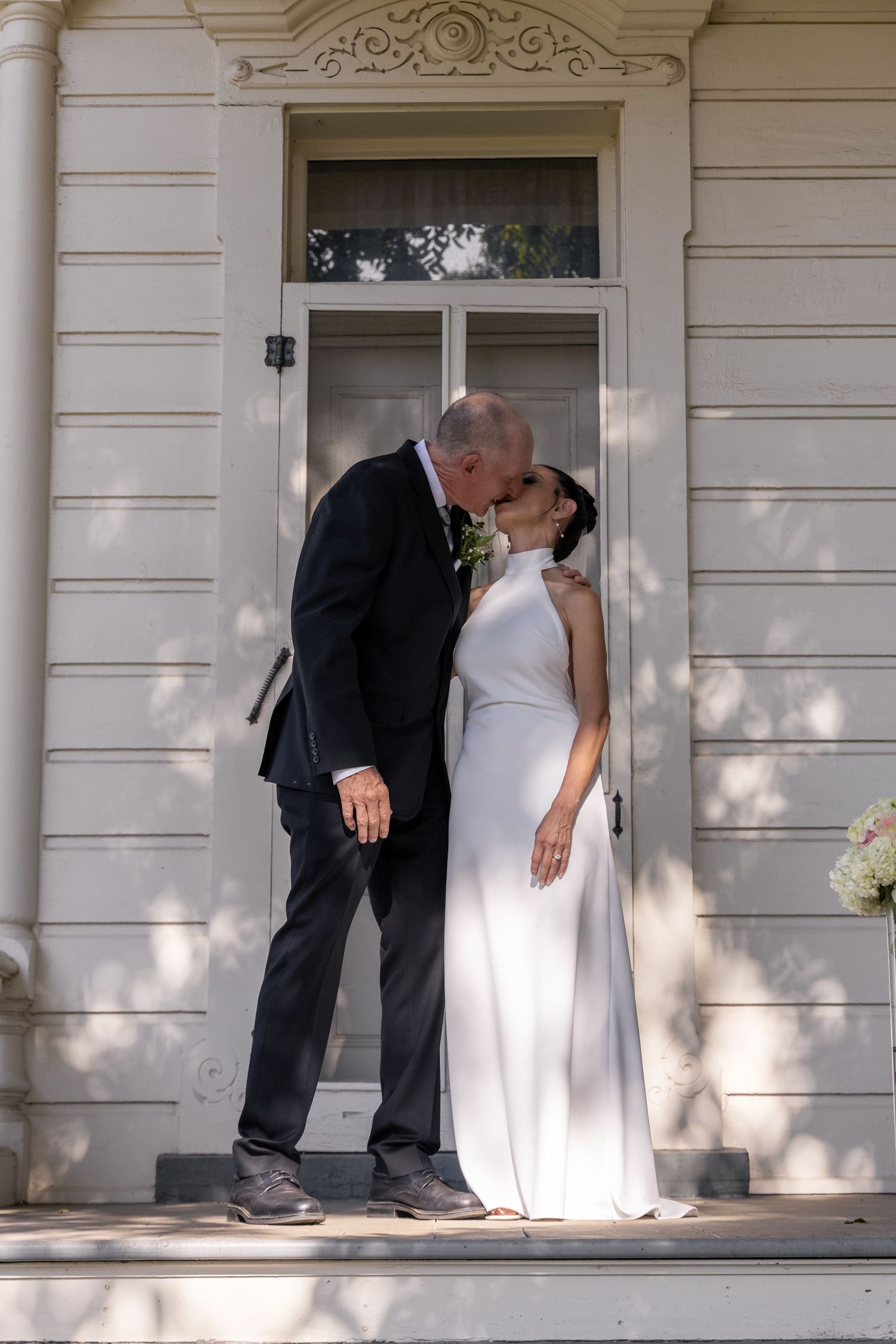 Romantic wedding sequence captured on a sunlit Victorian-style porch.