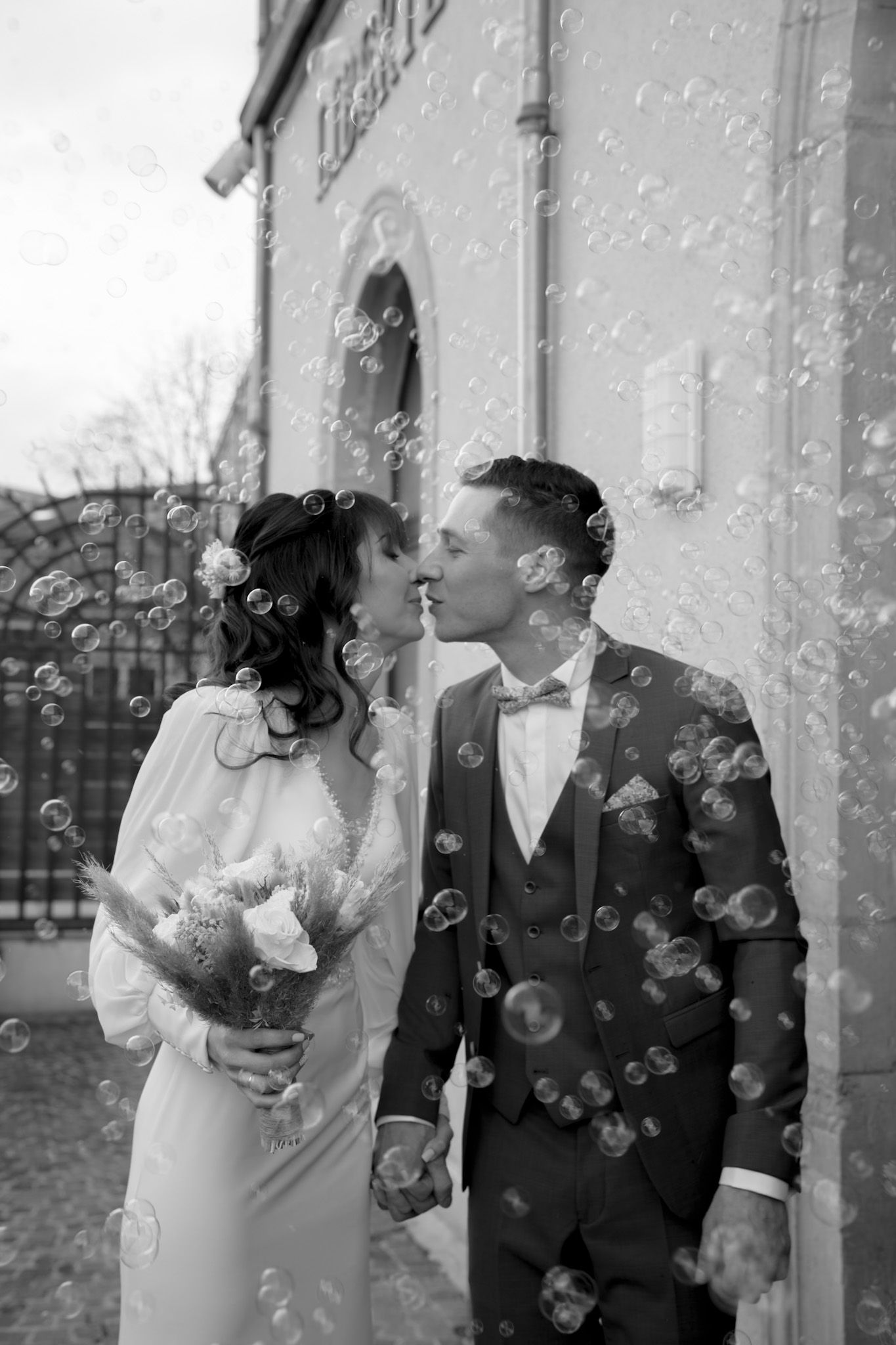 Wedding celebration sequence with confetti falling in black and white.
