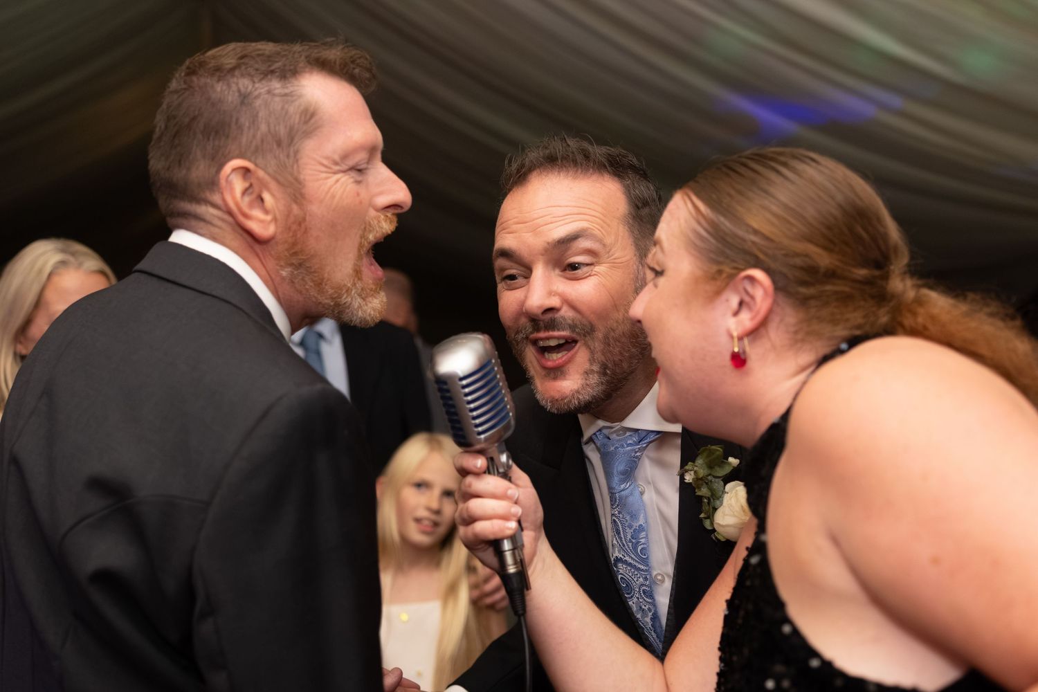 Groom and groom with singer