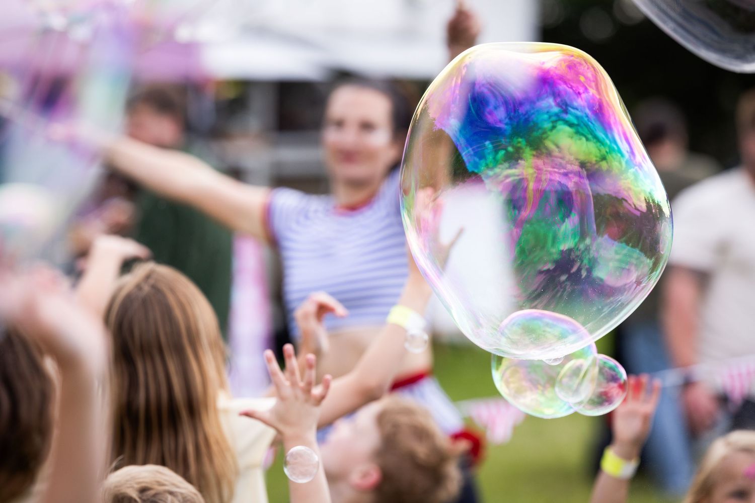 A bubble suspended in mid air at a party