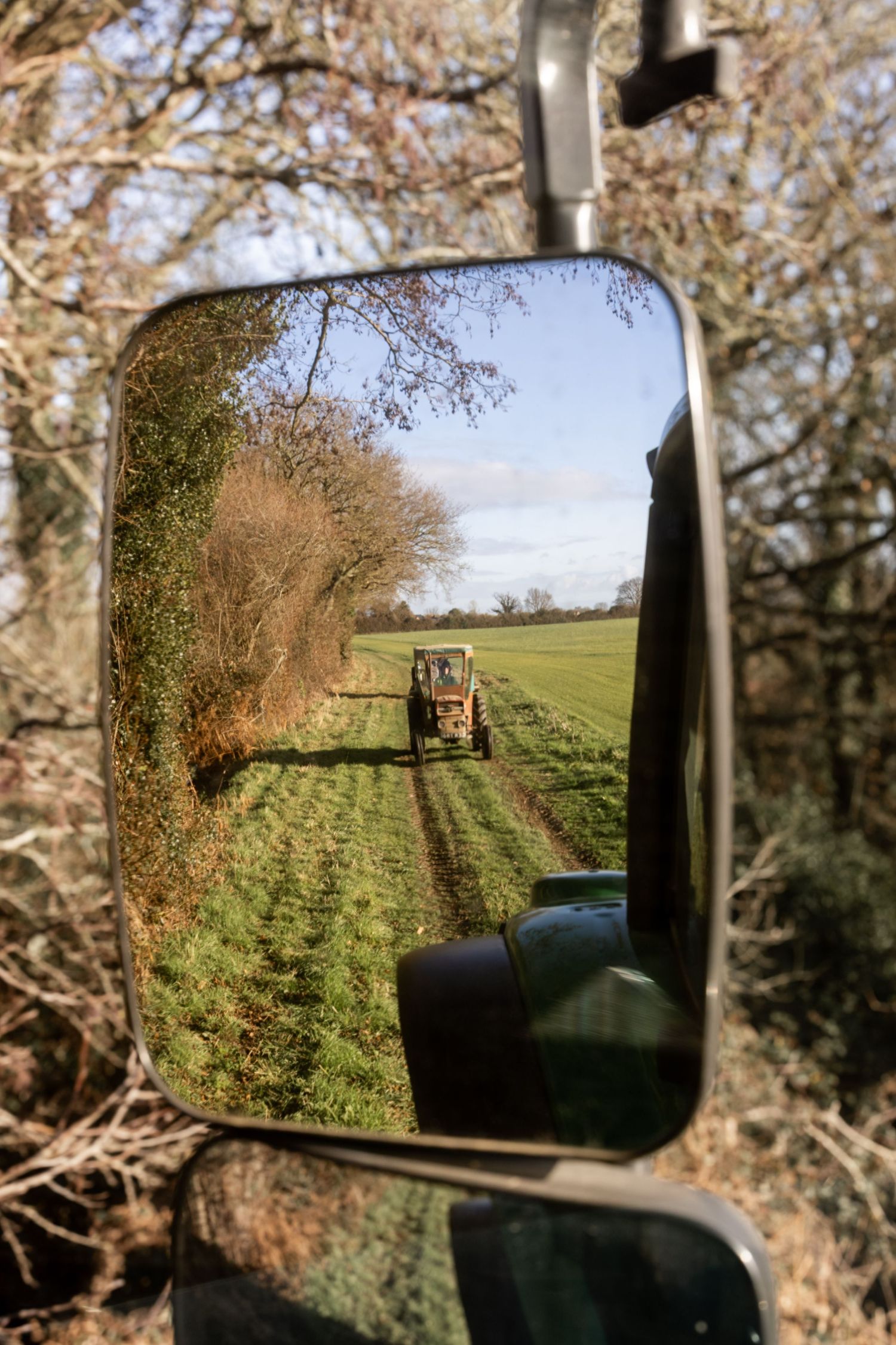Tractor in a rear view mirror