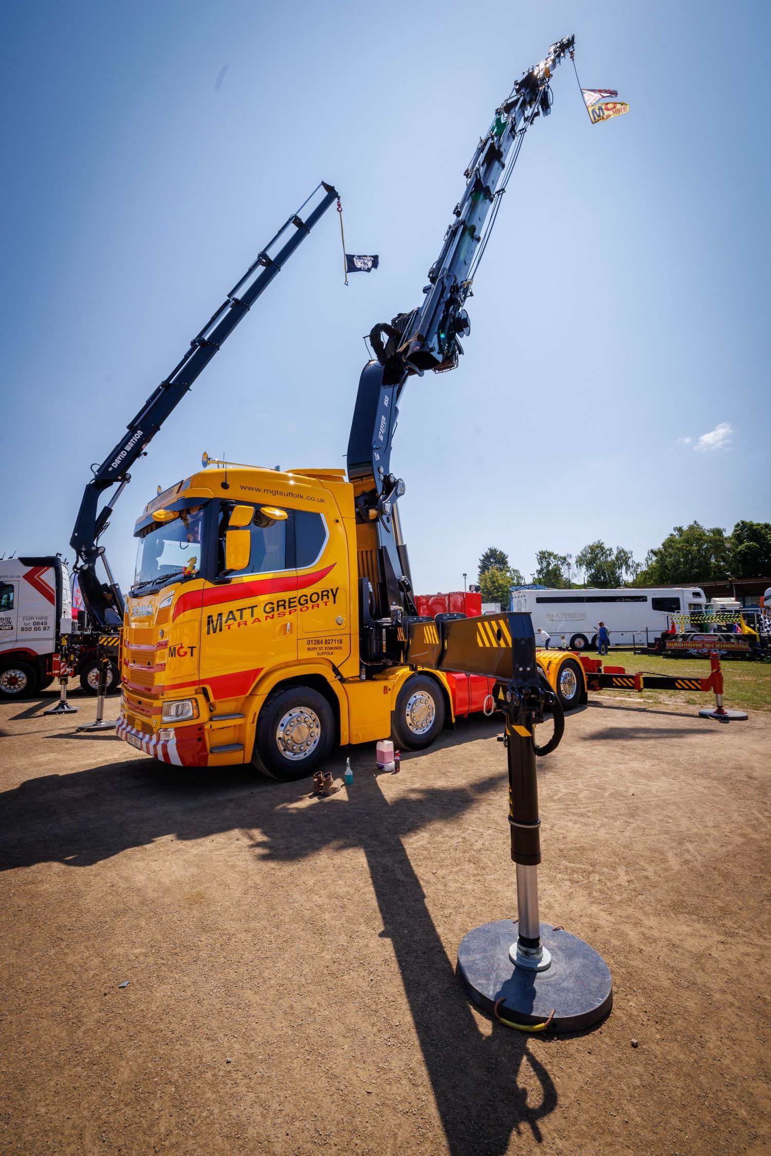 Crane truck with boom and stabilisers extended