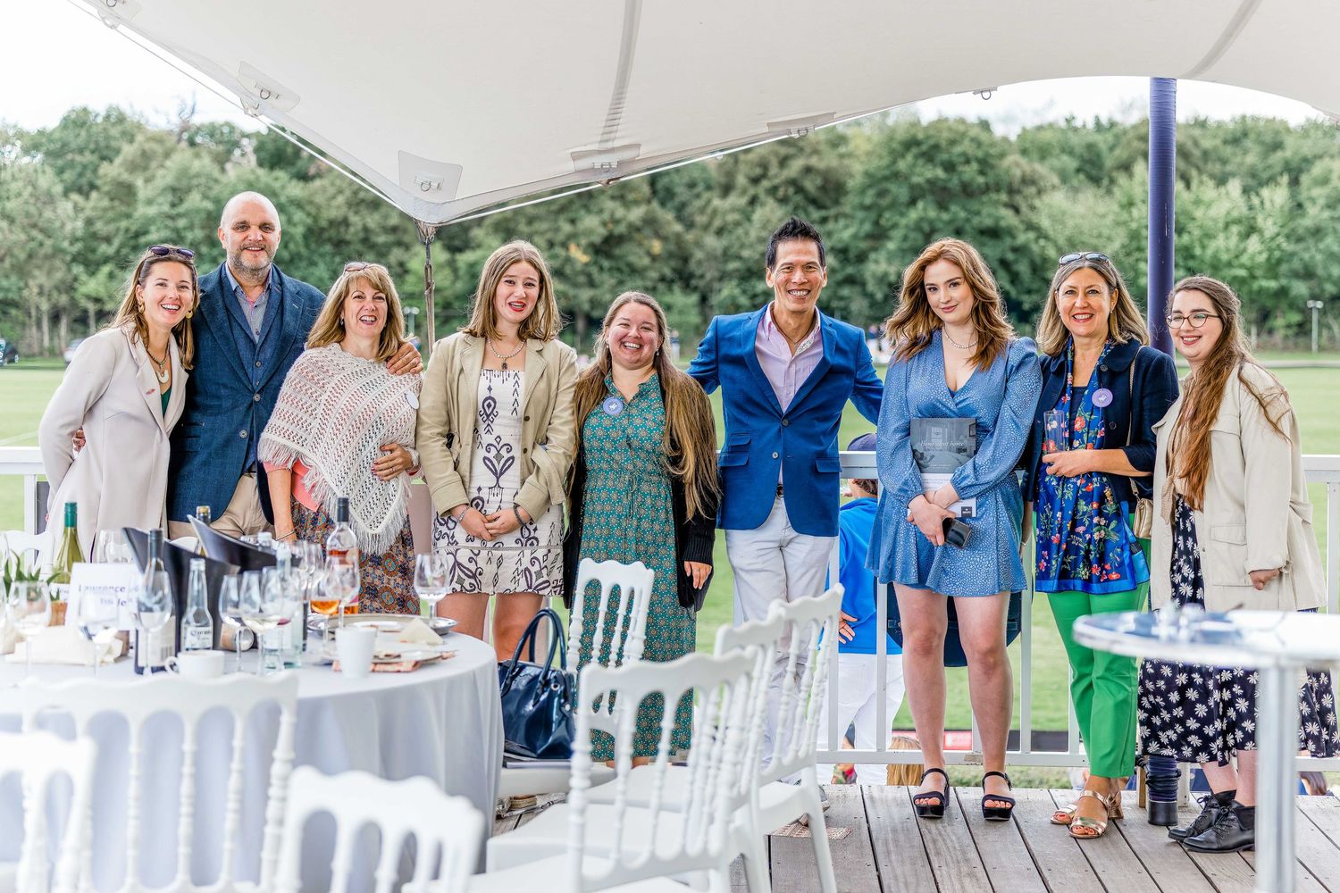 A group portrait of party goers at Ham Polo Club