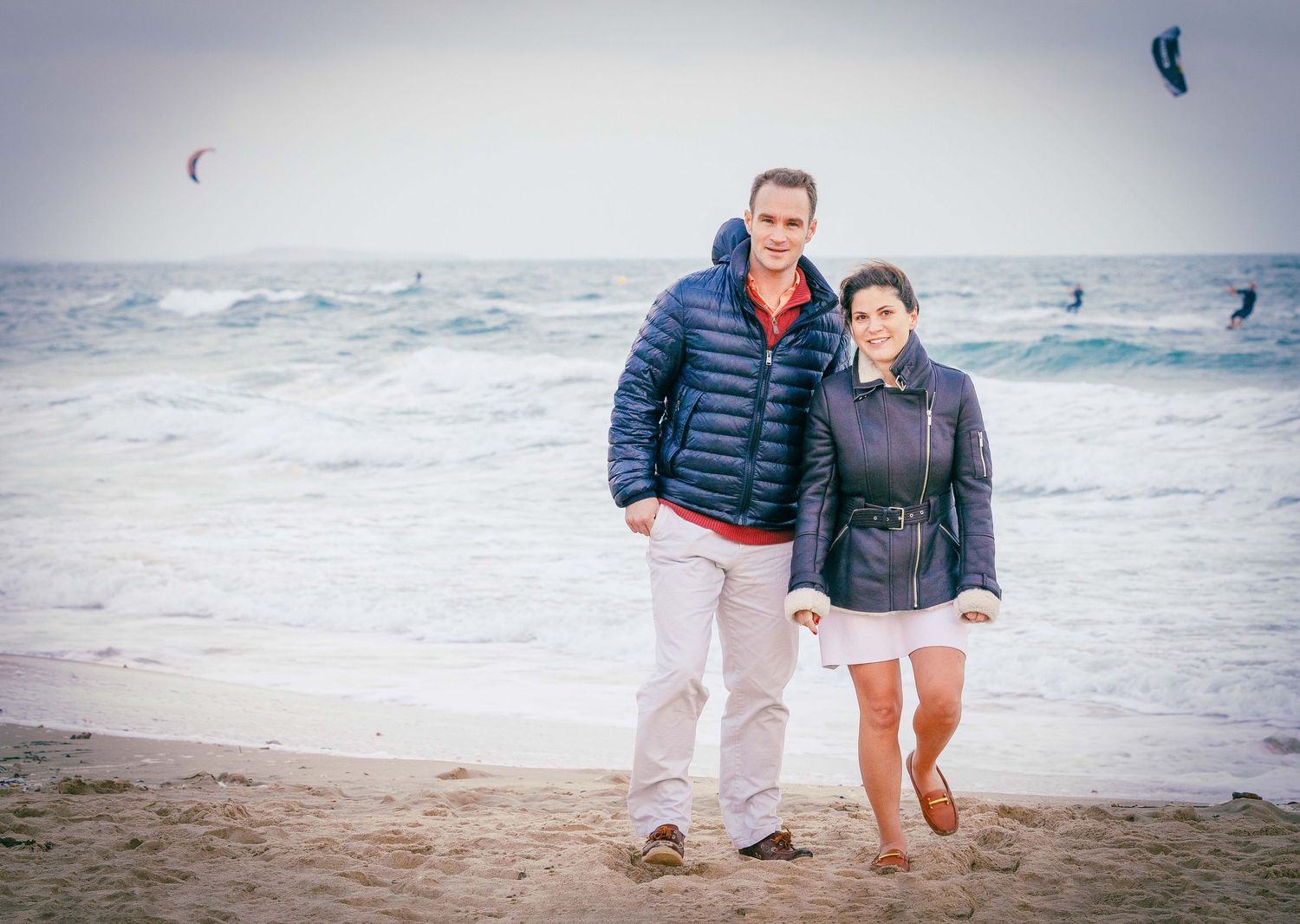 Couple walking on the beach, Poole Dorset