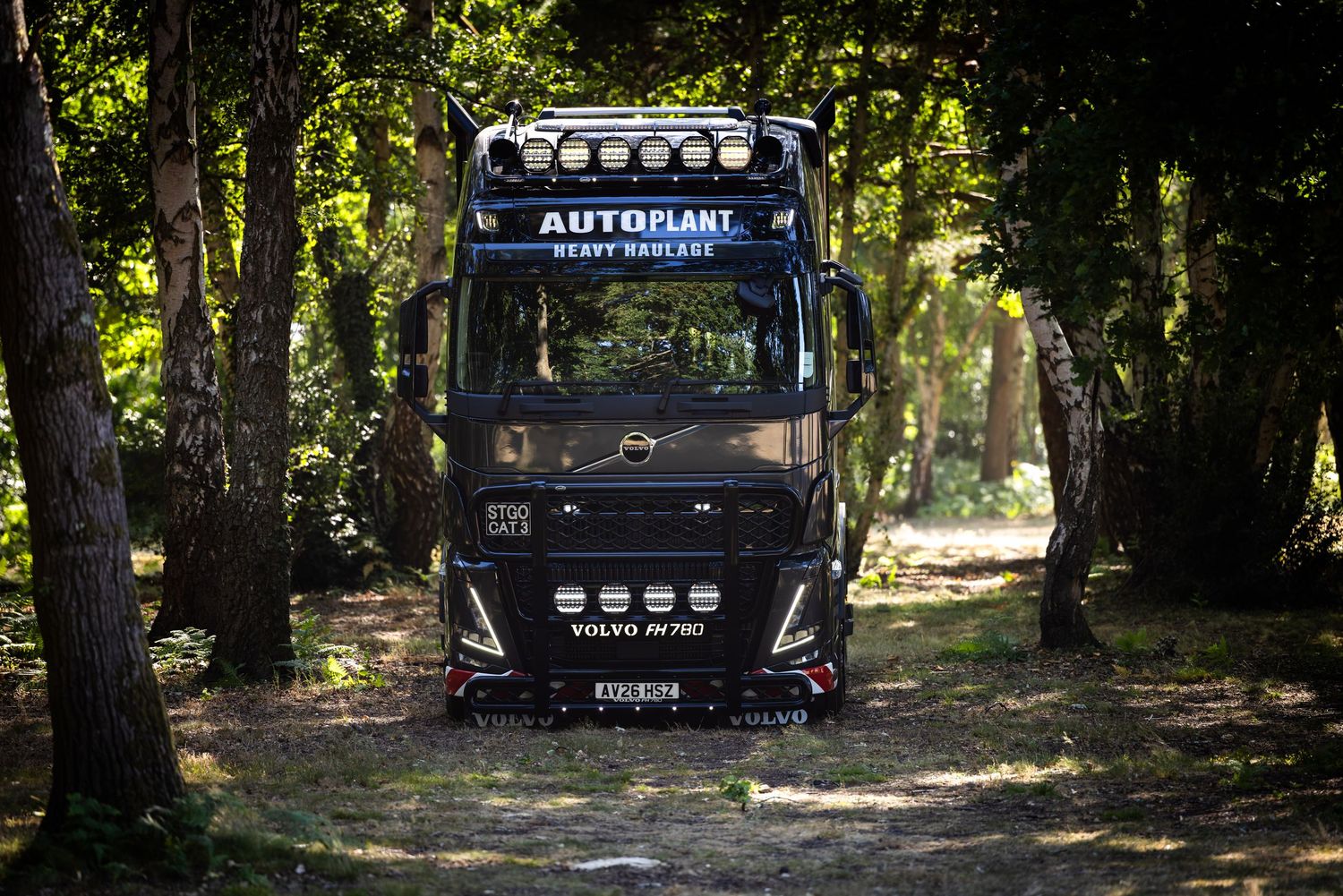 A black Volvo FH16 at Foxhall Stadium