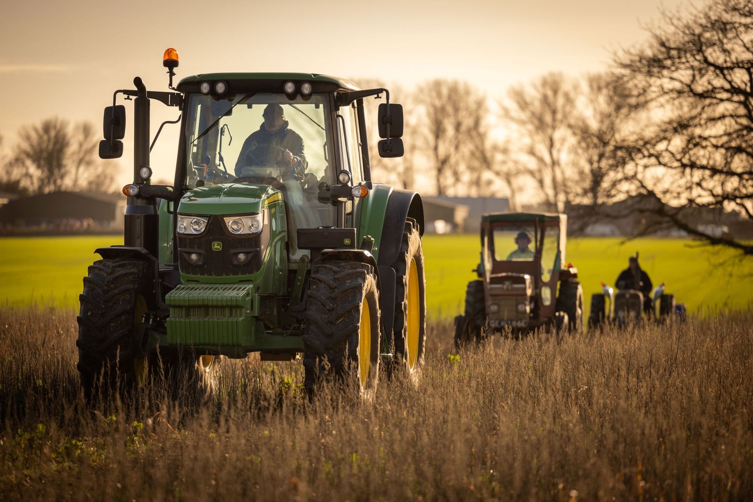 Three tractors in the winter sun