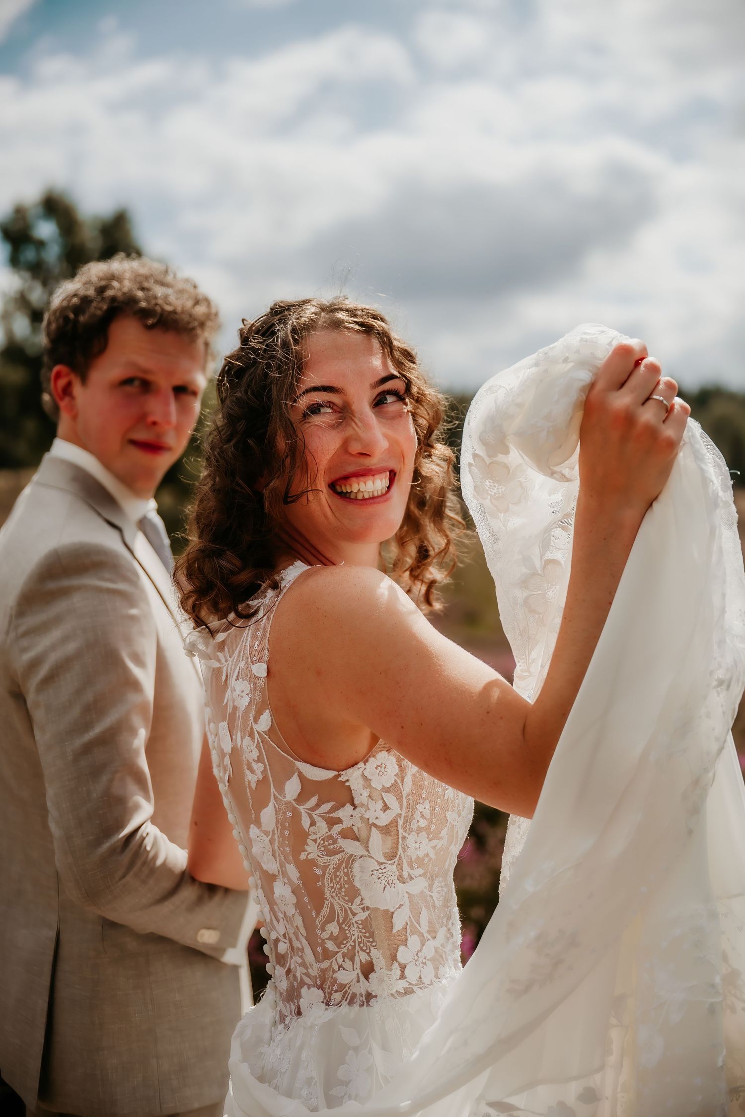 Delicate lace details on a wedding dress shown in multiple close-up shots against a cloudy sky.