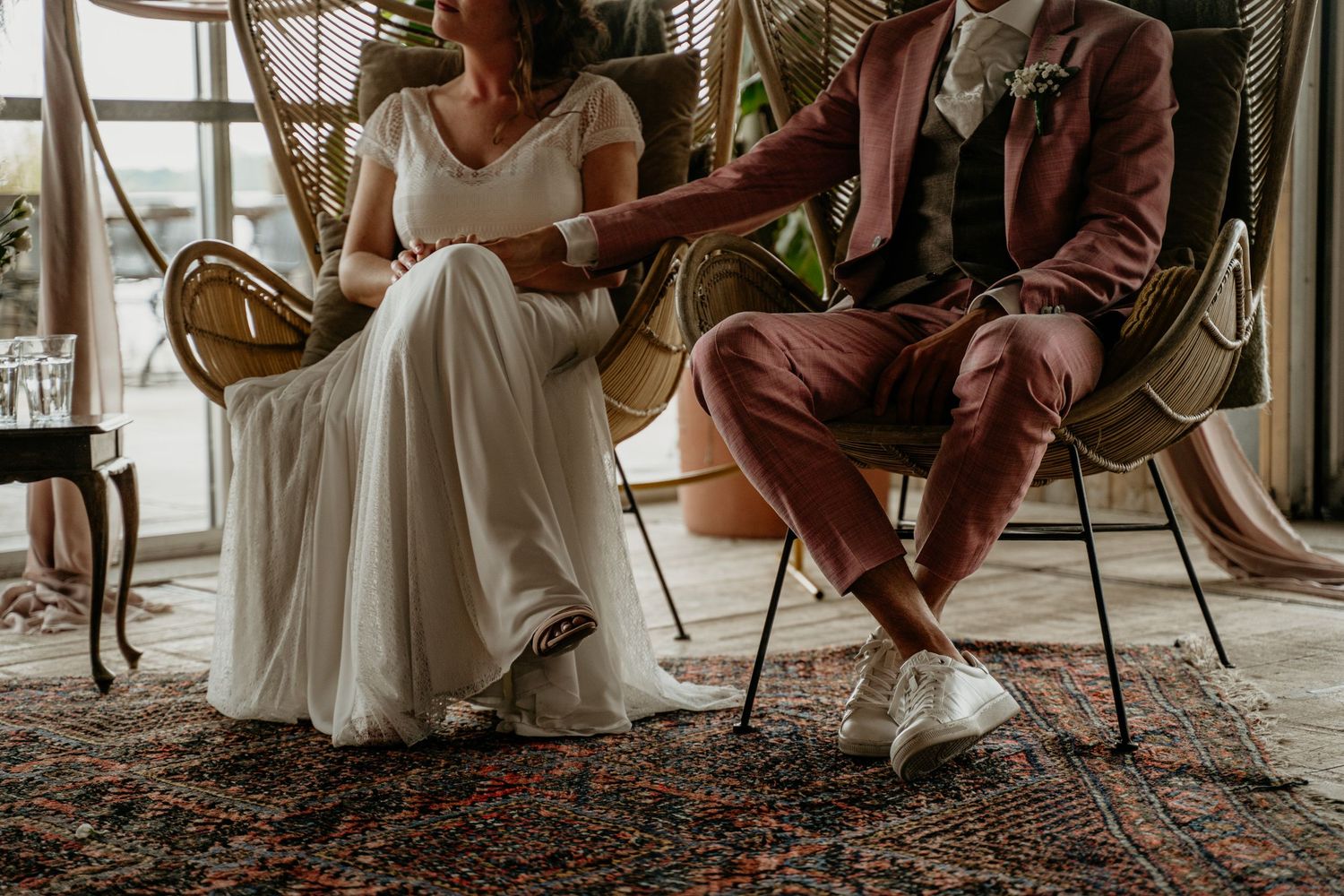 Wedding reception setup with vintage furniture and intimate seating arrangements.