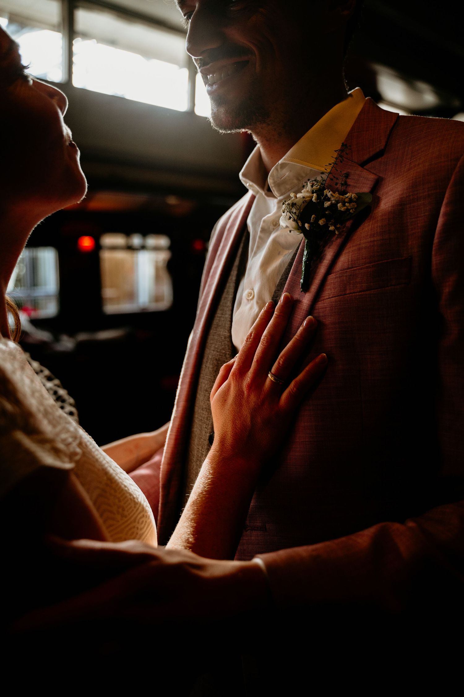 A series of intimate candid moments captured in moody lighting showing hands and silhouettes at a social gathering.