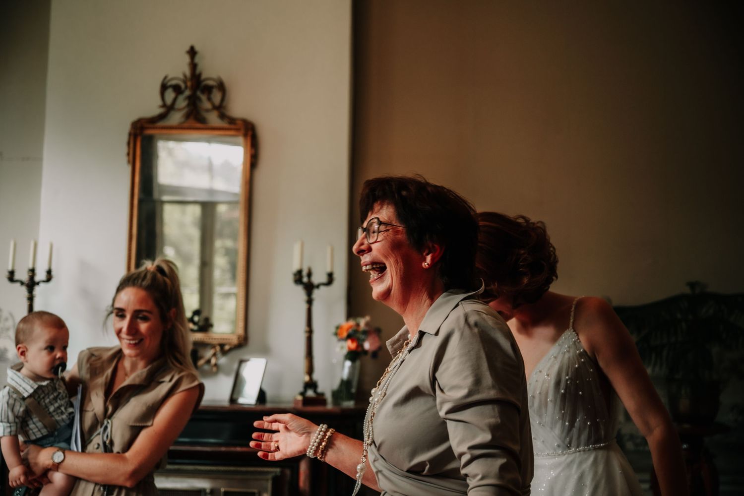 Emotional reactions captured during wedding speeches at an indoor reception.