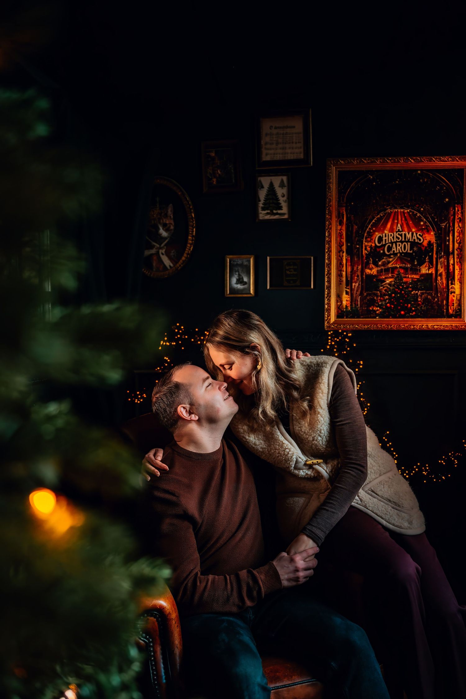 A couple shares an intimate moment in a dimly lit room with warm ambient lighting and decorative elements in the background.