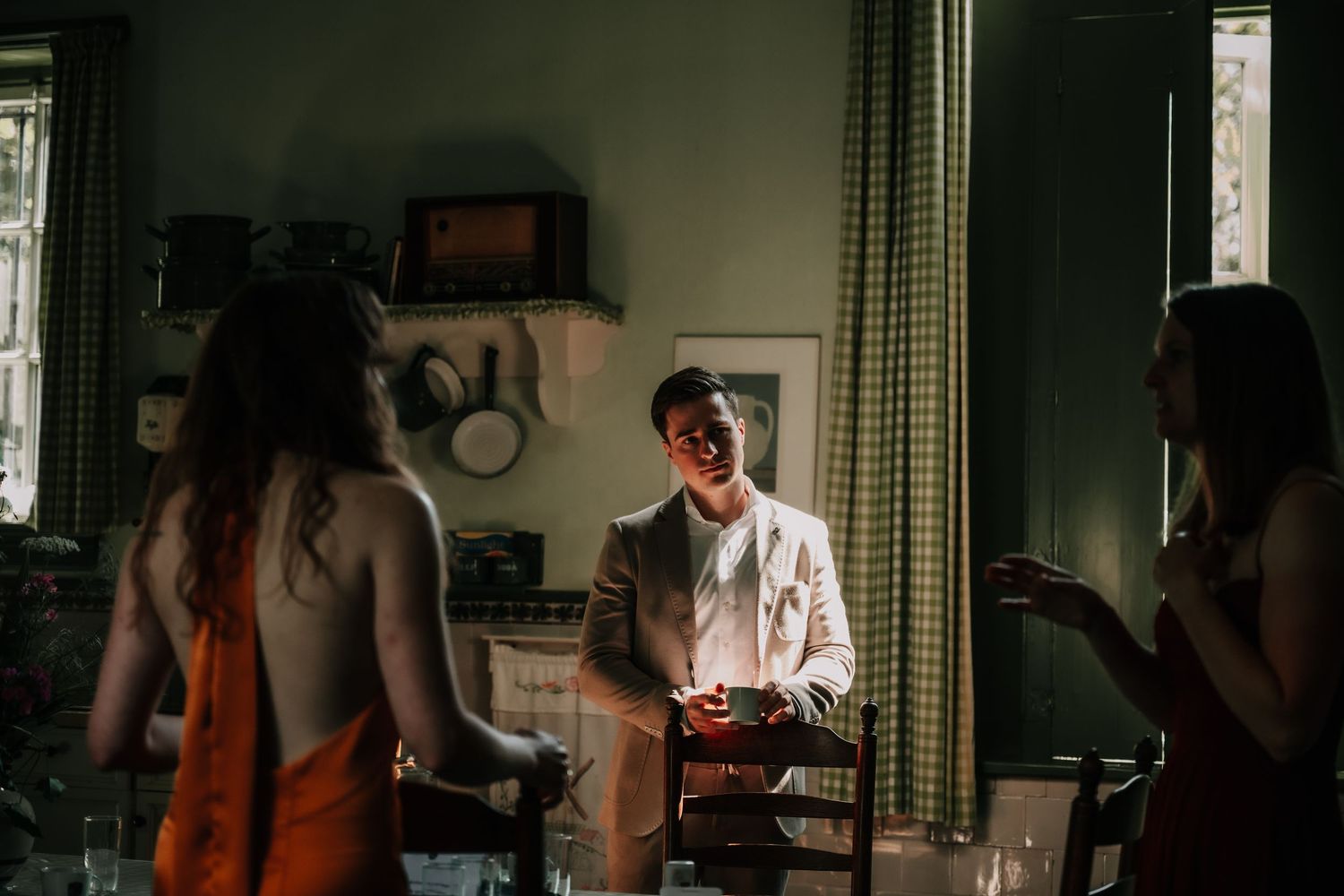 A series of dark moody film stills showing interior domestic scenes with dramatic lighting and shadows.