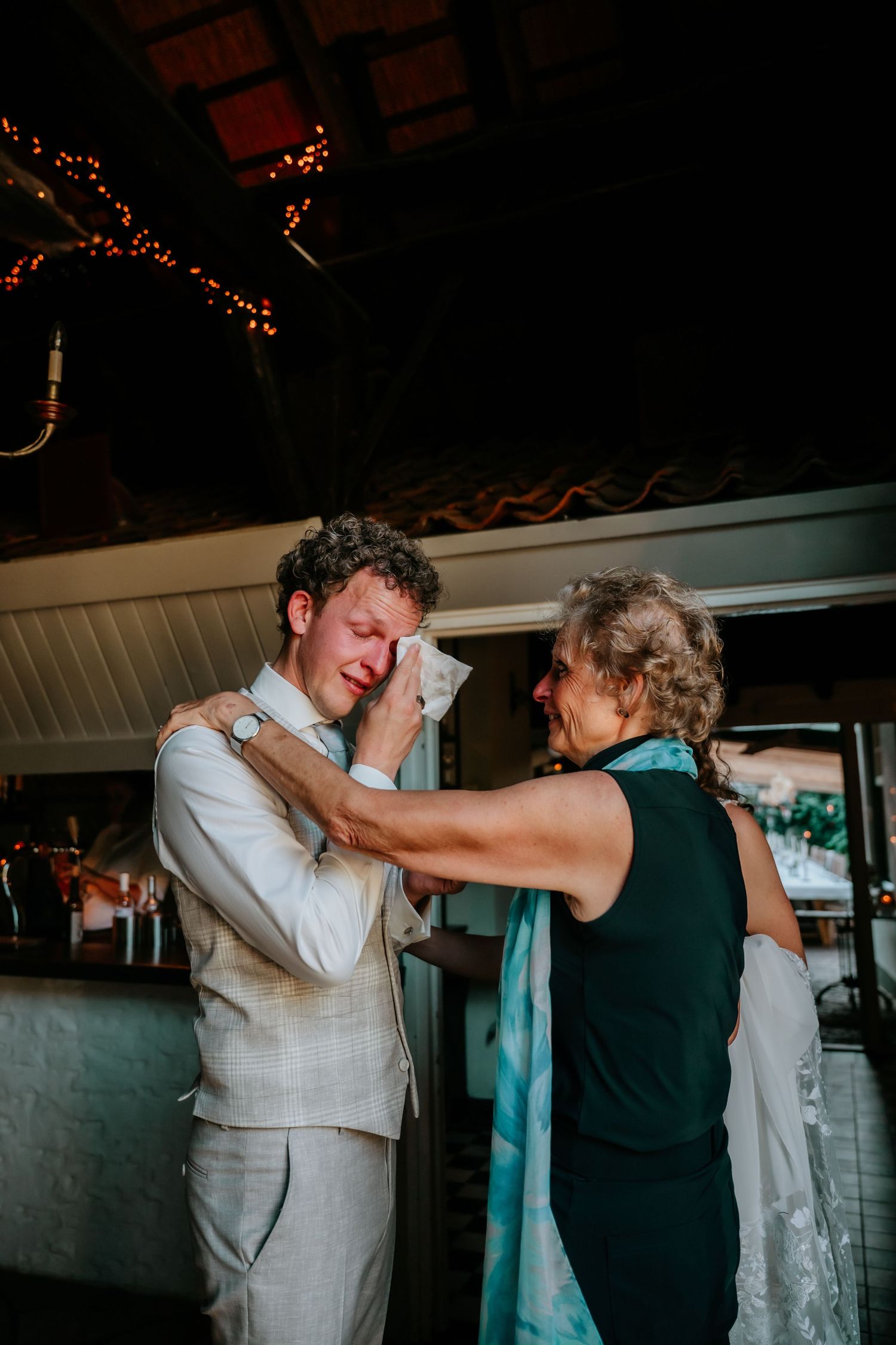 Couple shares an emotional dance moment during their wedding reception.