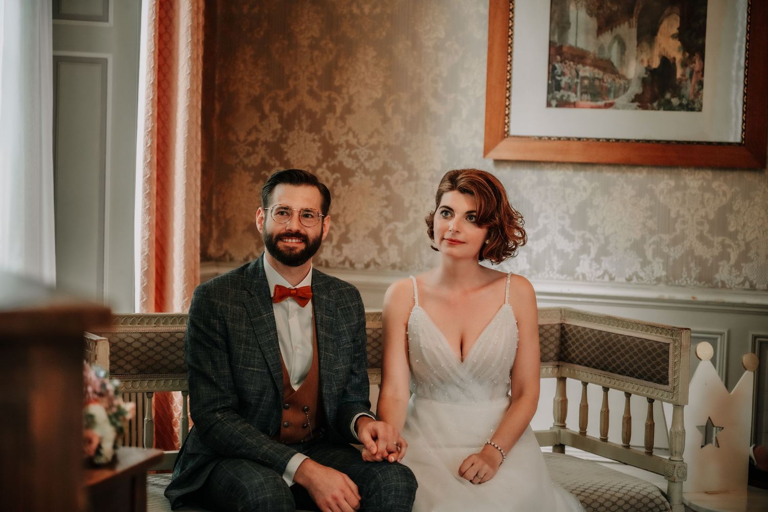 A couple shares an intimate moment during their wedding reception.
