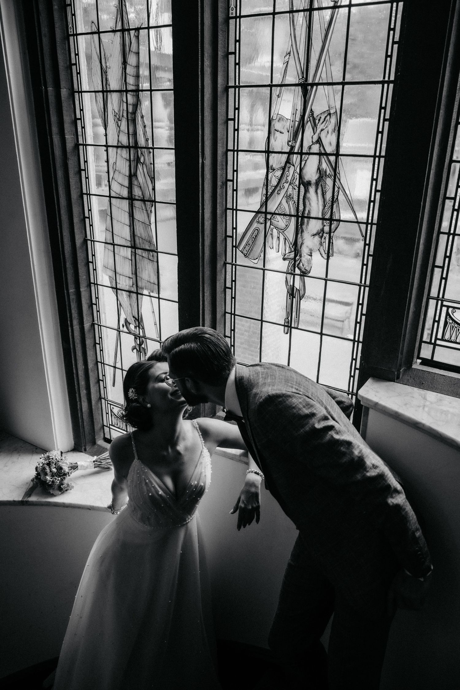 A series of moody black and white window photographs showing dramatic lighting and shadows.
