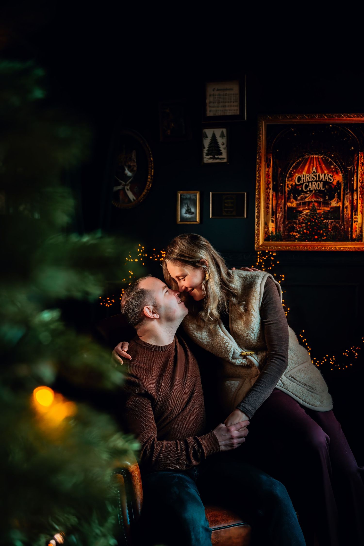 A romantic couple sharing an intimate moment on a couch with twinkling lights and dark ambiance in the background.