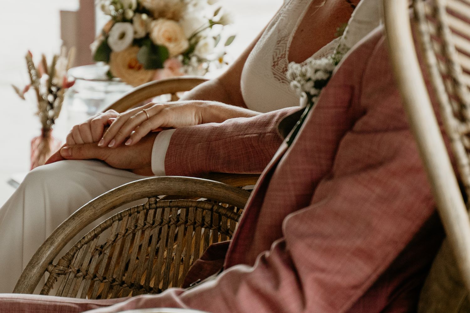 Close-up details of wedding attire and decor in warm, vintage tones.