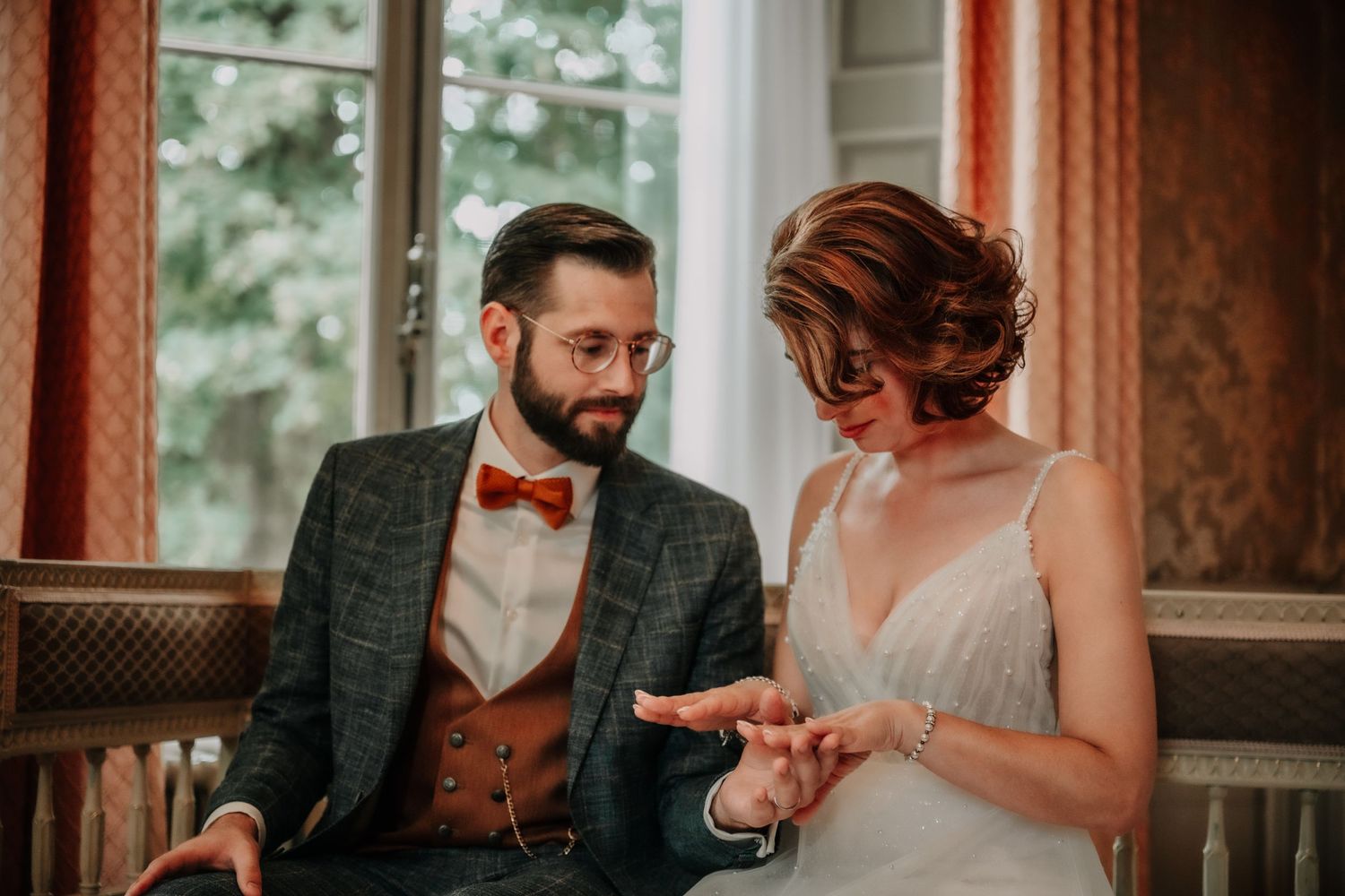 Wedding celebration in a rustic room with warm lighting and vintage decor.