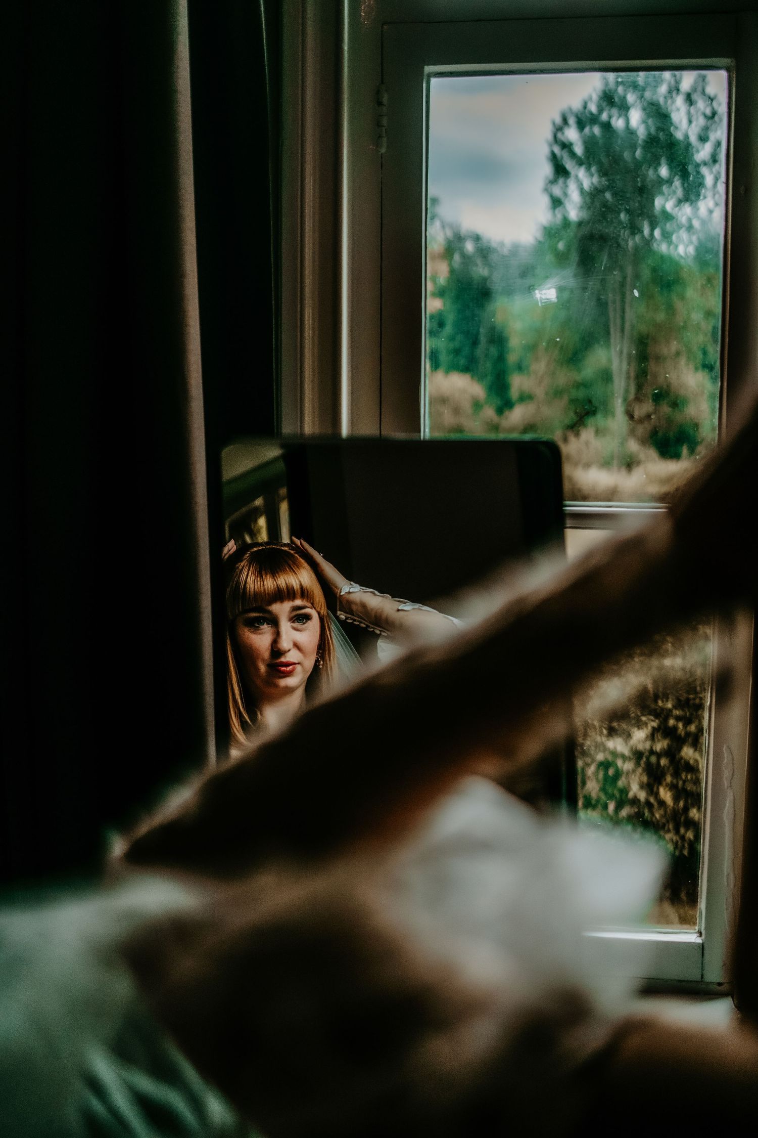 A series of moody window portraits captured in natural light with a green outdoor background visible.