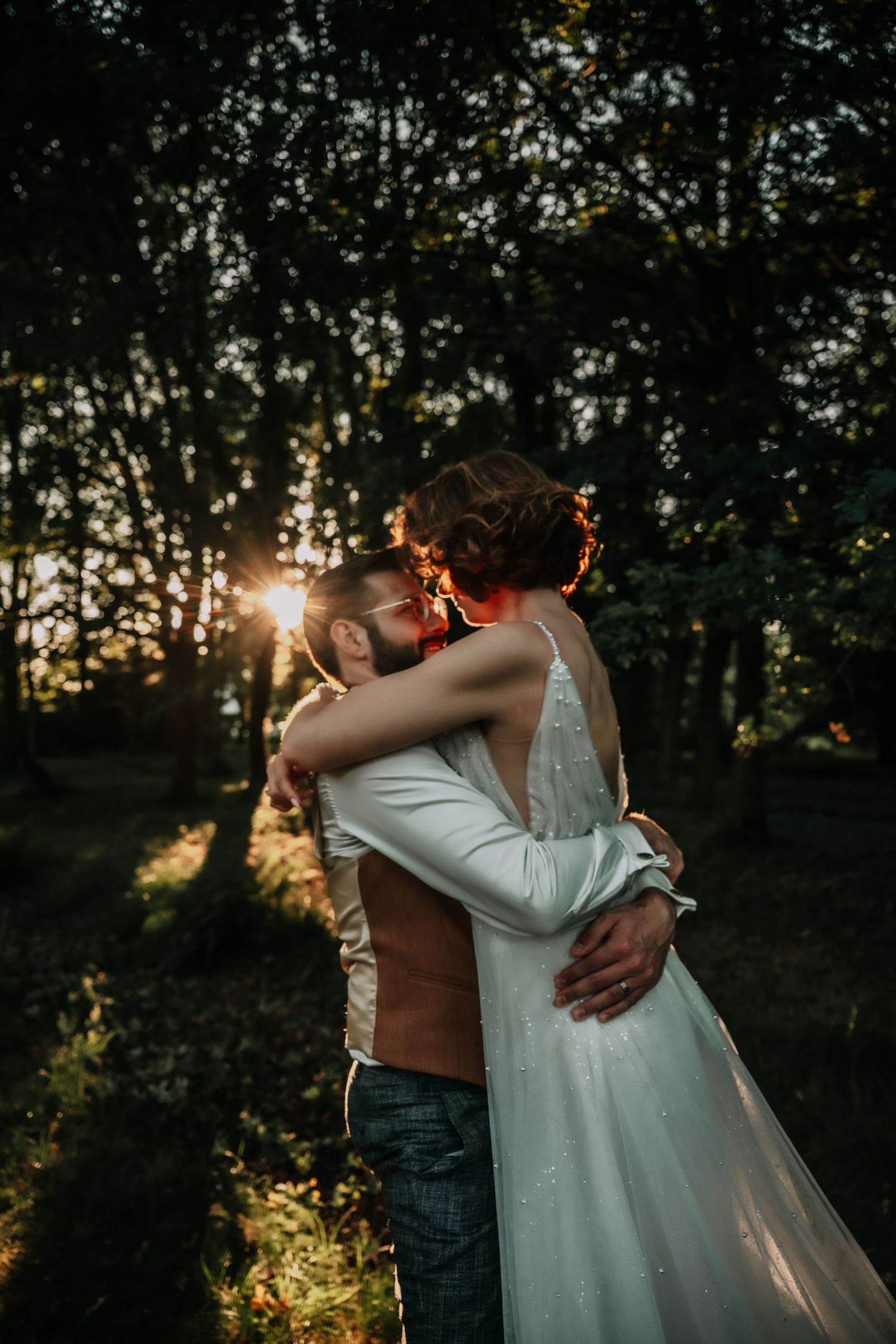 A romantic sunset photoshoot with golden light filtering through trees.
