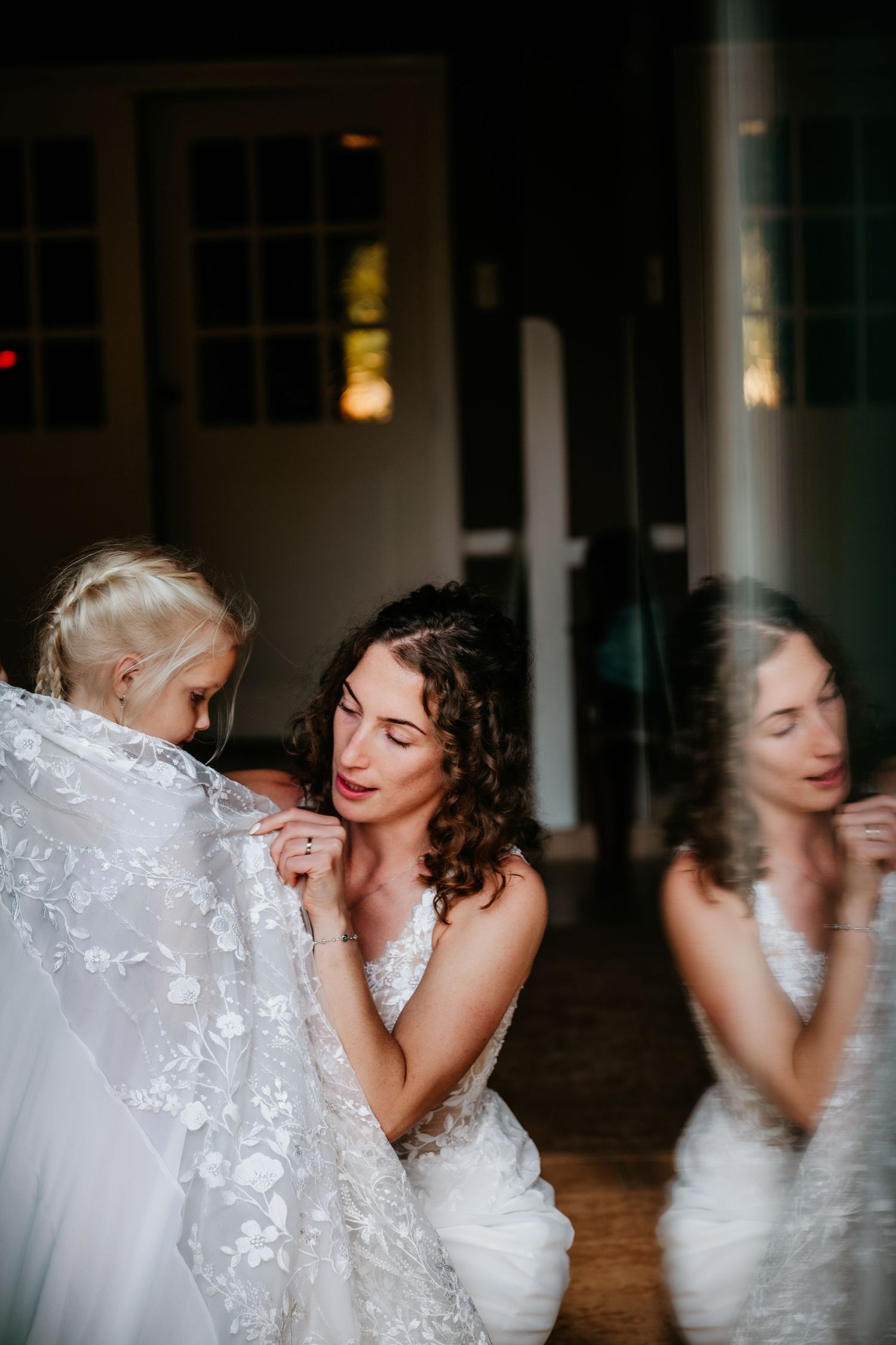 Wedding dance captured in motion with flowing white dress details.