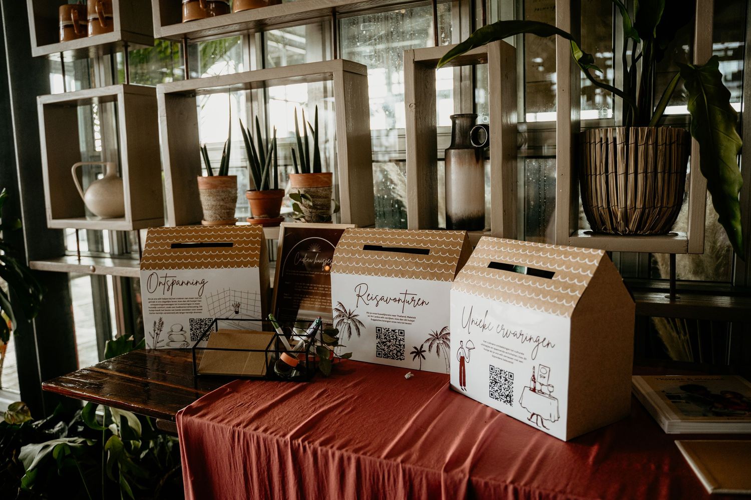 Wedding reception setup with rustic decor, signage and natural lighting in an indoor venue.
