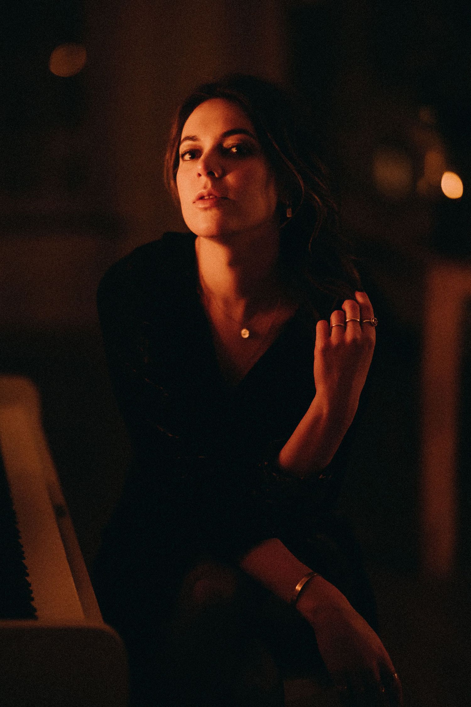 A series of dark, moody portraits showing dramatic lighting and shadows in a cinematic style.