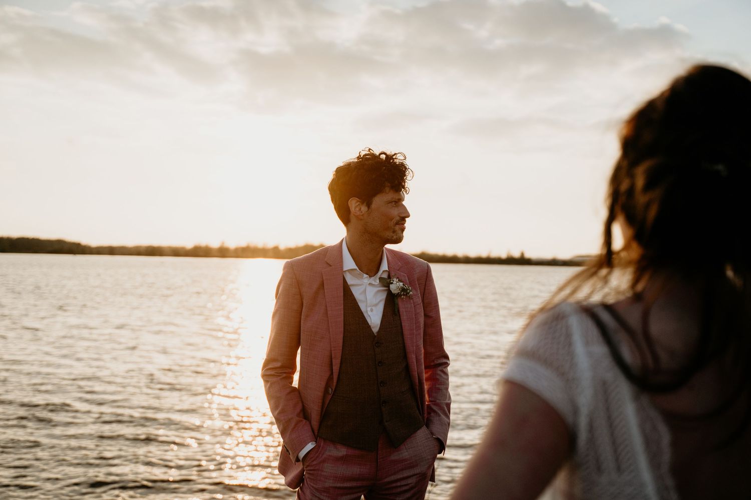 Romantic sunset waterfront scene with golden hour lighting.
