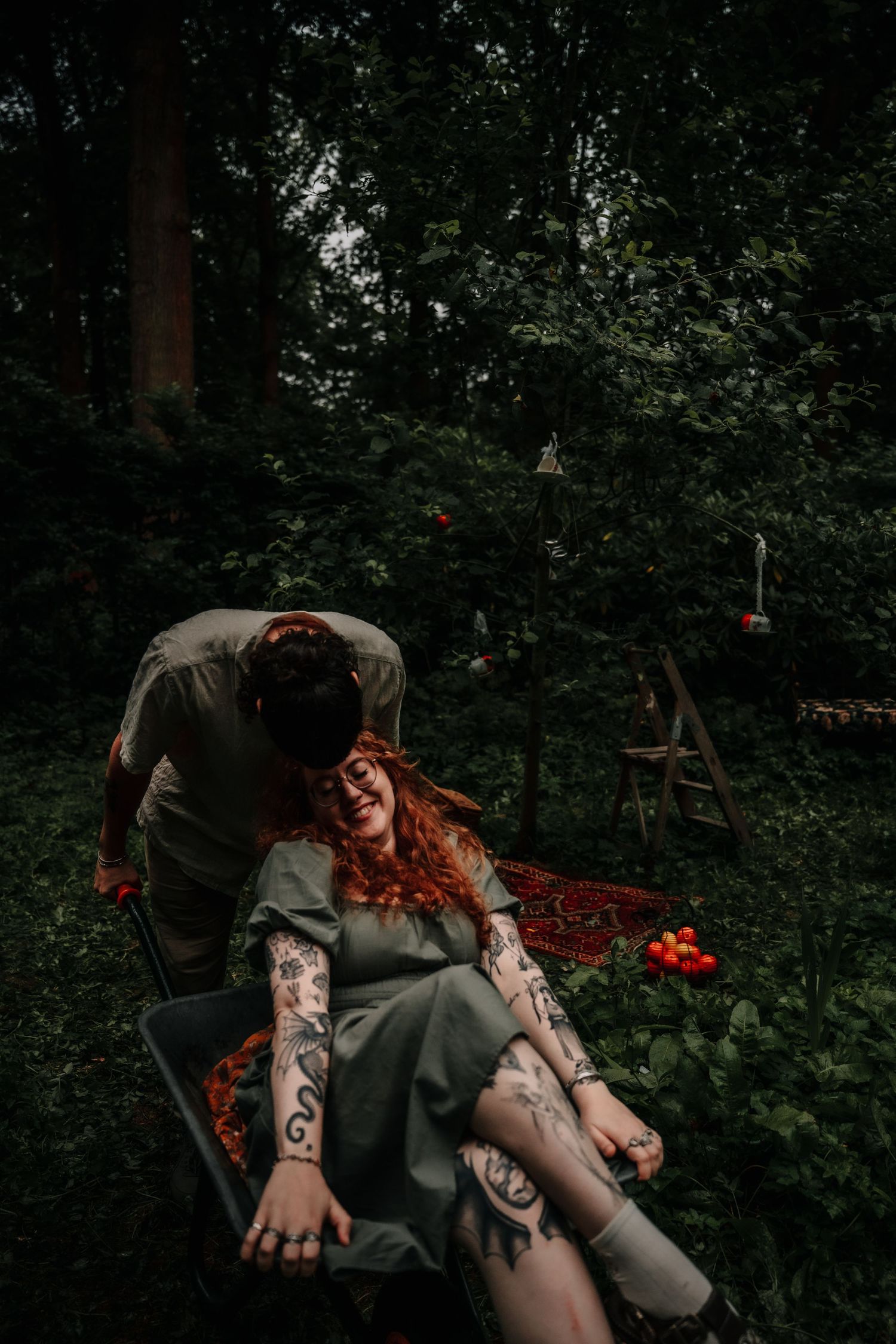 A series of dark, moody photos capturing a scene in a forest setting with eerie, horror-inspired artistic elements.