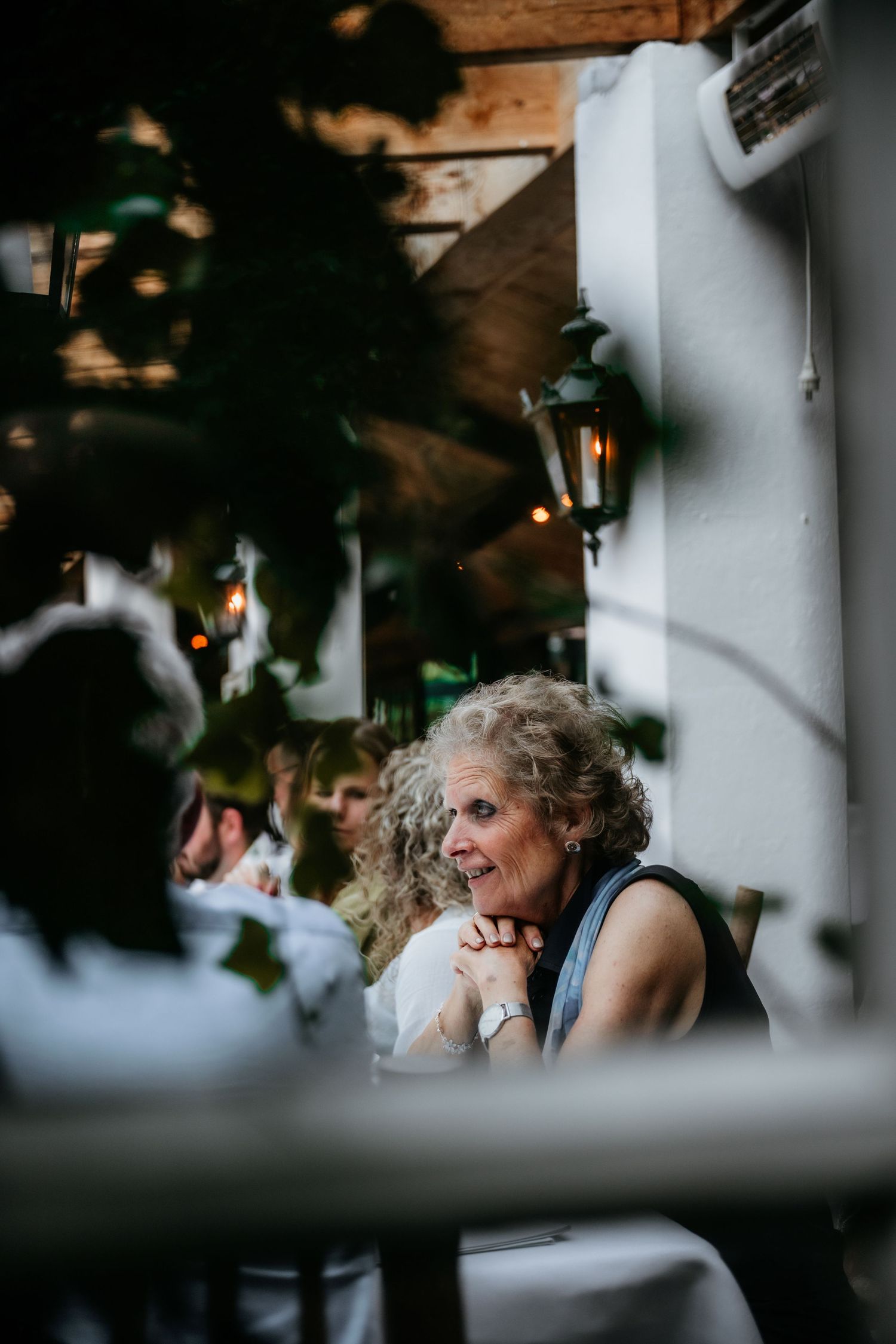 Candid moment captured during an intimate outdoor reception.