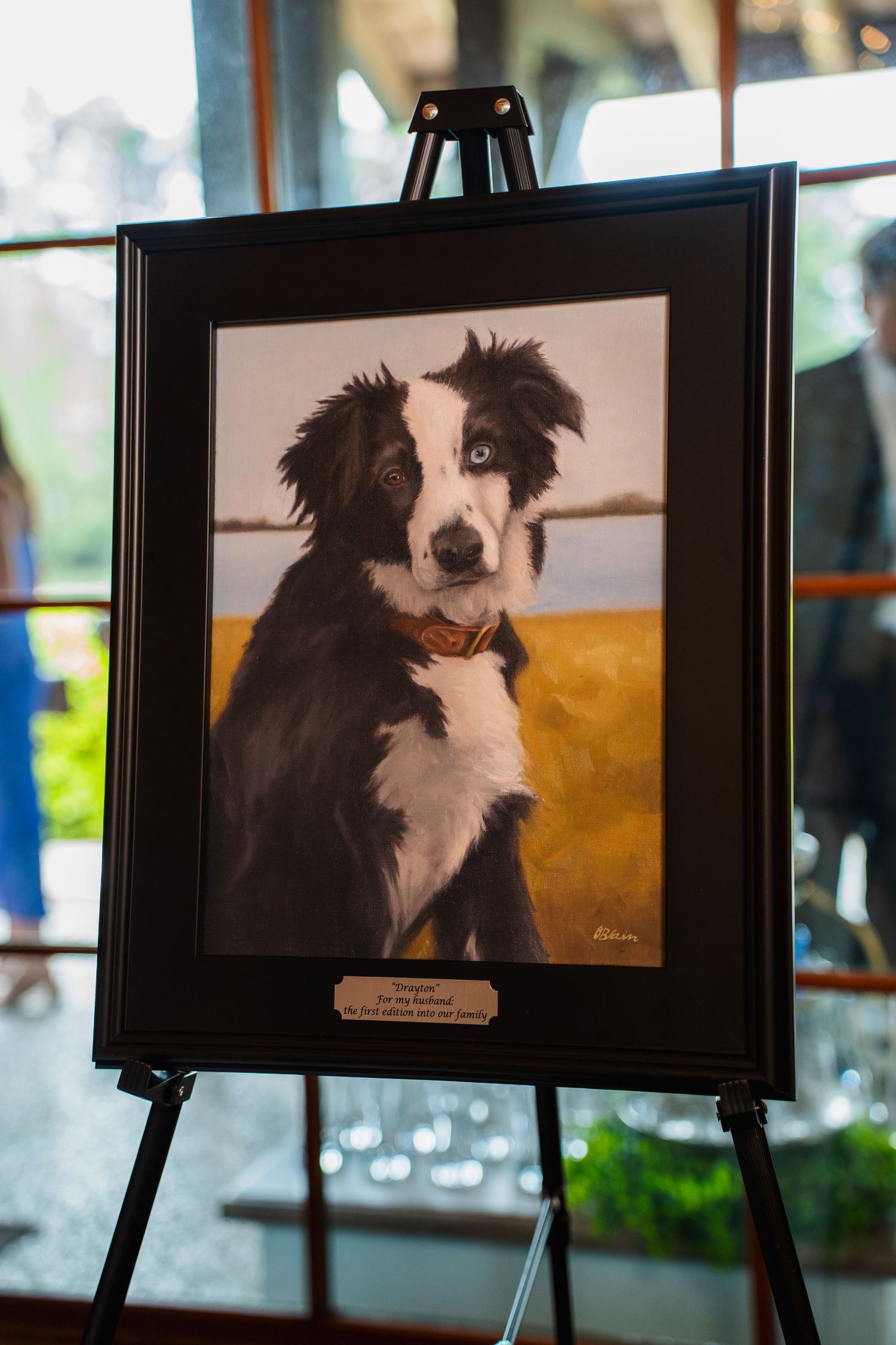 Commissioned oil portrait of a black and white dog by Olivia Blain