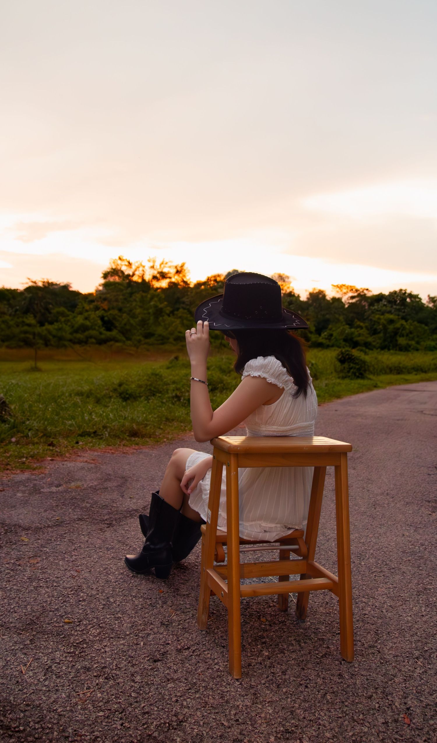 cowgirl watching the sun sets