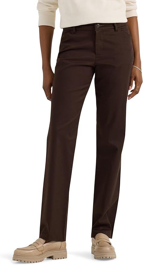 Brown chino pants shown from waist down with beige sweater and boots.