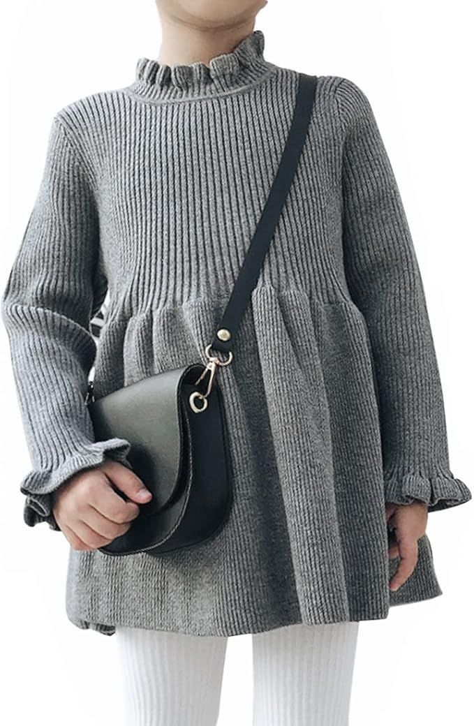 Gray ribbed turtleneck sweater with peplum waist and black crossbody bag.