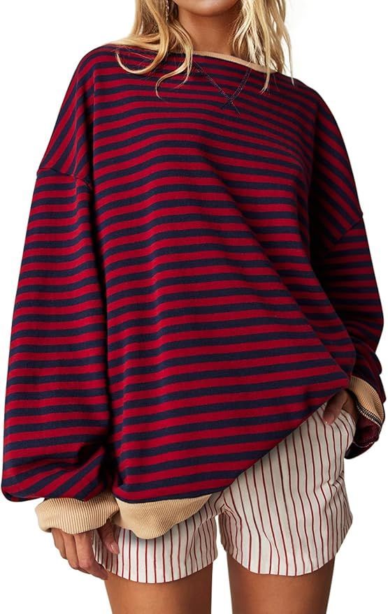 Oversized striped sweater in burgundy and navy with balloon sleeves.
