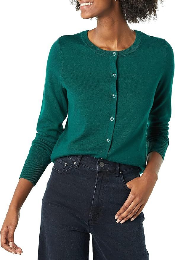 Emerald green cardigan sweater paired with dark jeans in a casual style.