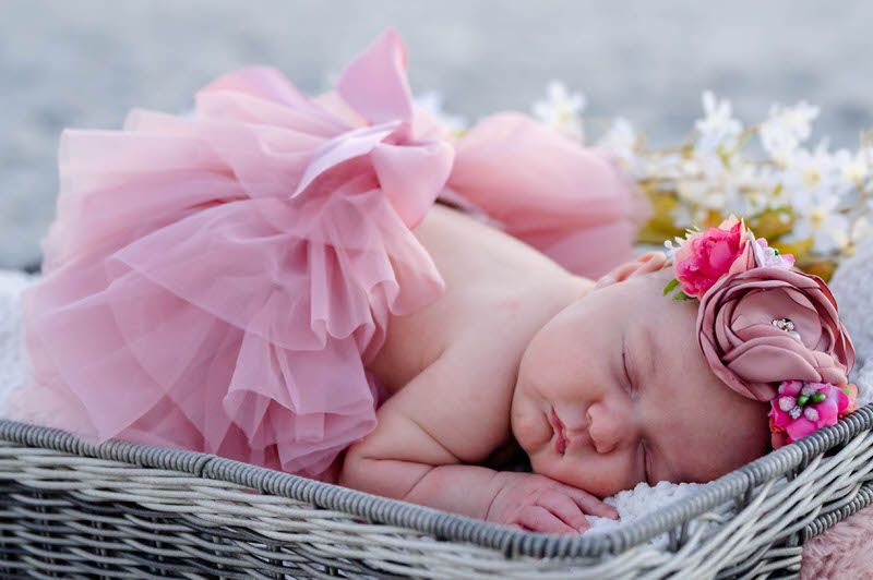Newborn baby girl in pink on Jacksonville beach taken by Jessica Life Jacksonville Newborn Photography