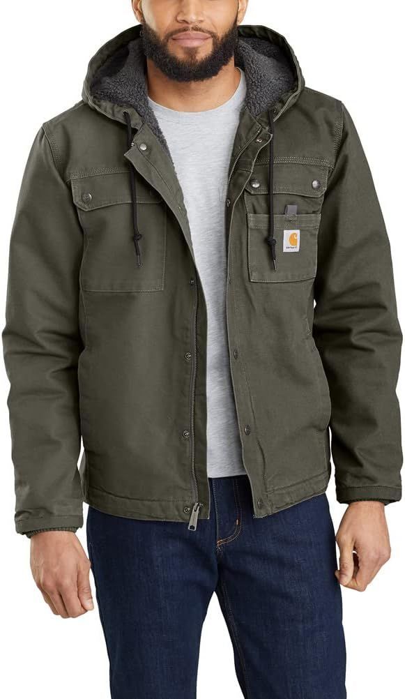 Olive green Carhartt hooded work jacket with sherpa lining and multiple pockets.