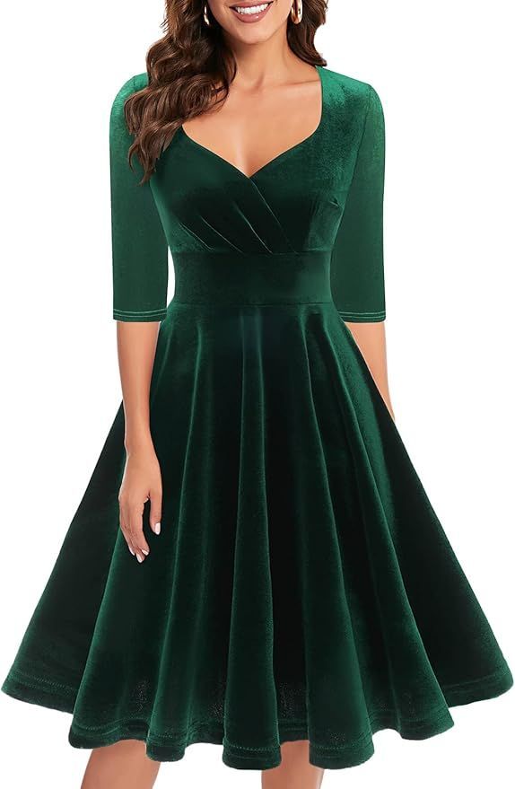Vintage-style emerald velvet dress with sweetheart neckline and full skirt.