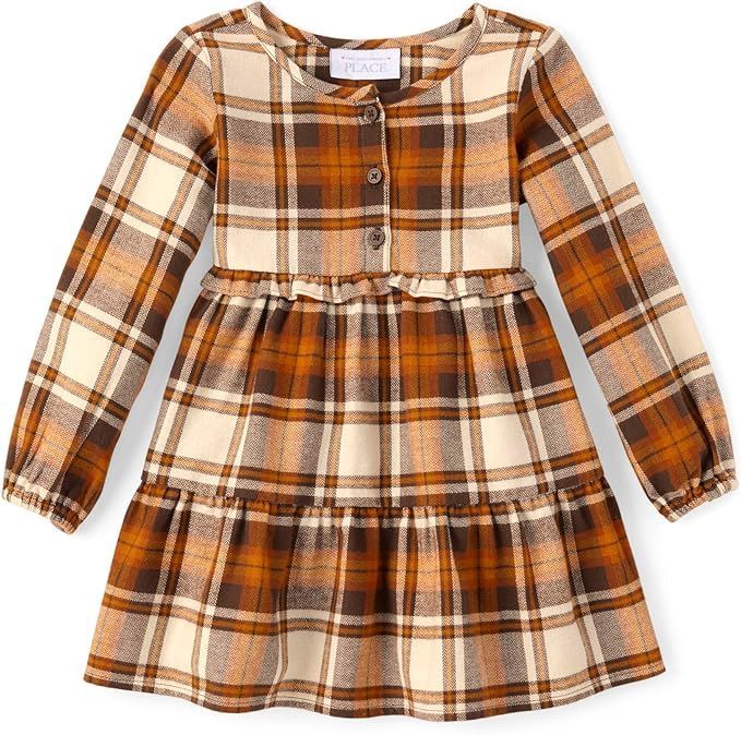 Brown and cream plaid baby dress with gathered waist and button details.