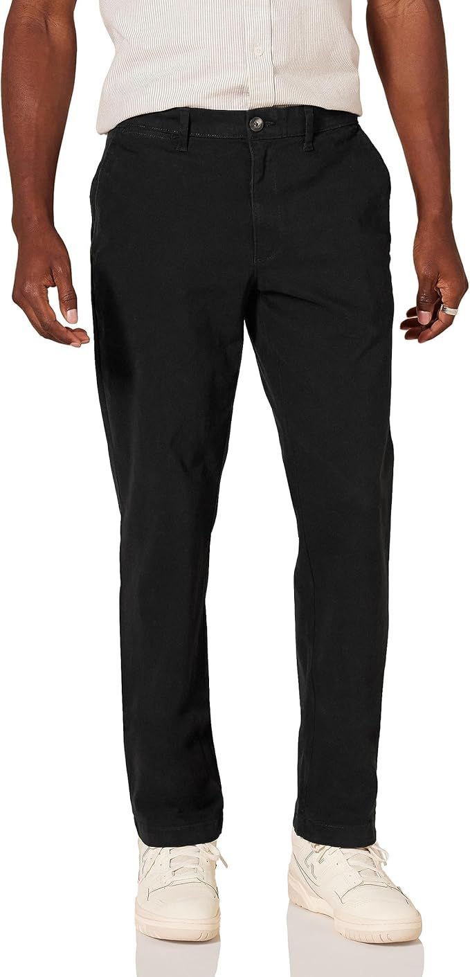 Black pants with white sneakers shown from waist down in multiple poses.