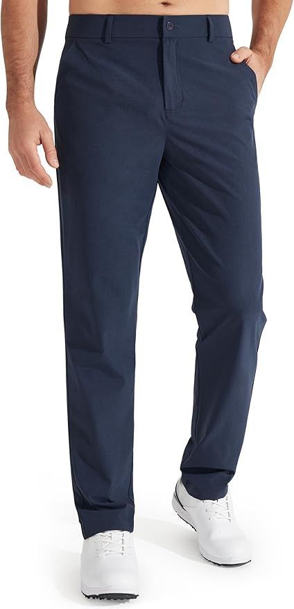 Navy blue men's casual pants shown with white sneakers from ankle view.
