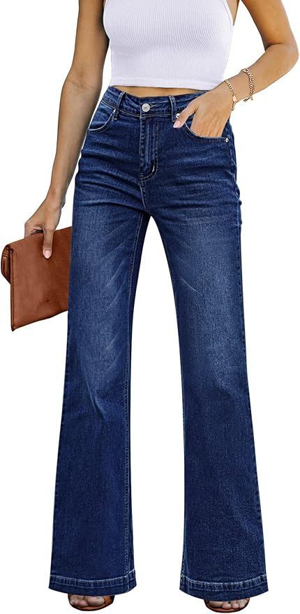 Wide-leg dark blue denim jeans shown with white top and brown clutch.