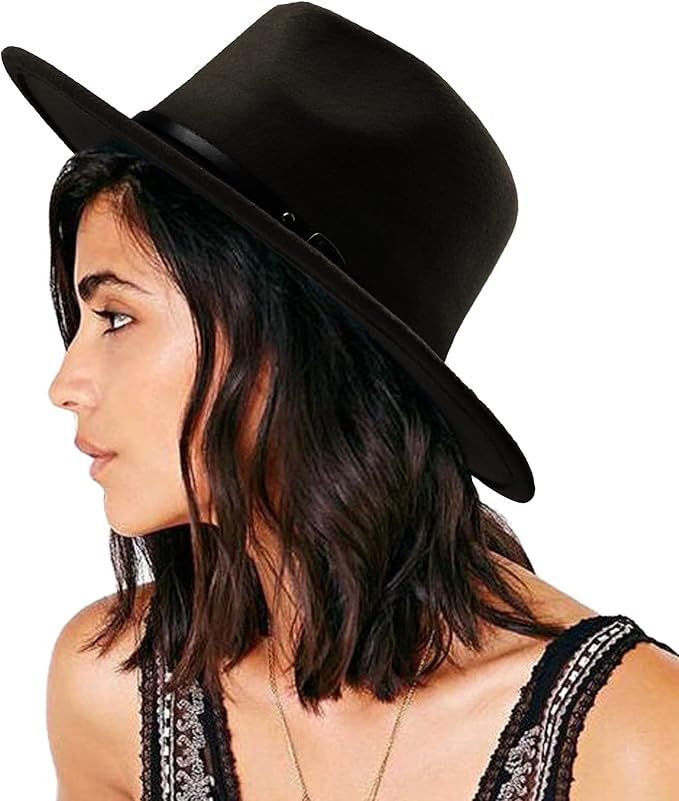 Profile view of black wide-brim fedora hat on dark-haired model.