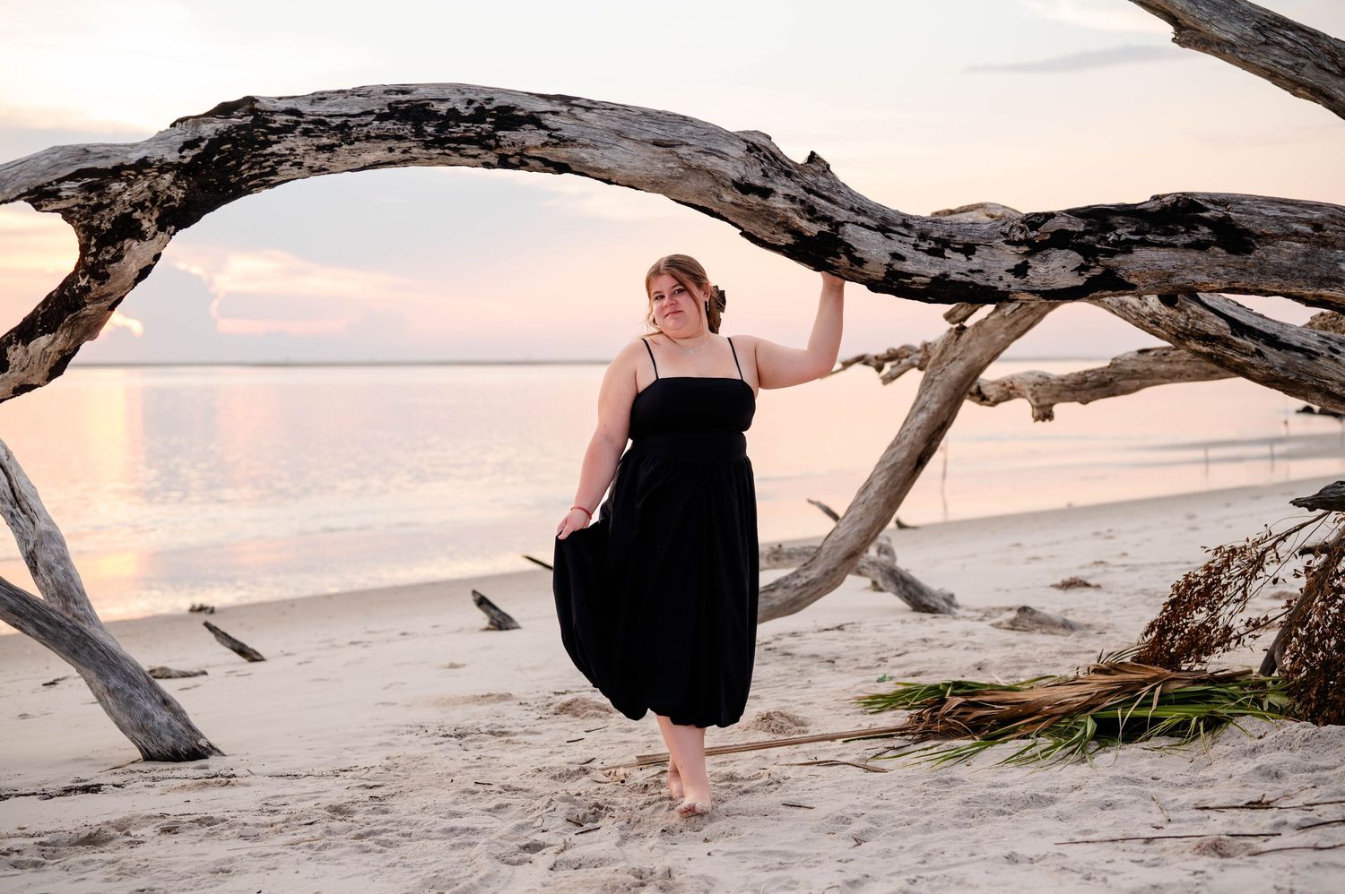 A collection of scenic beach photos with driftwood and sand during sunset at the shoreline.
